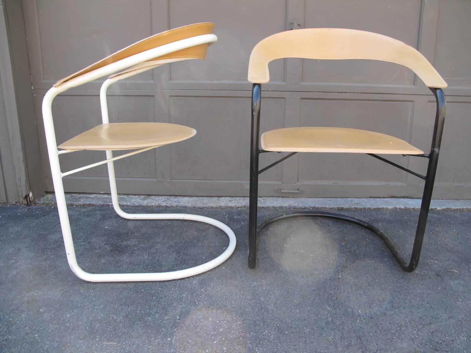 Two Modern Italian chairs. Tubular painted frames, one in black and one in white. Top-stitched leather seats and back. Marked 