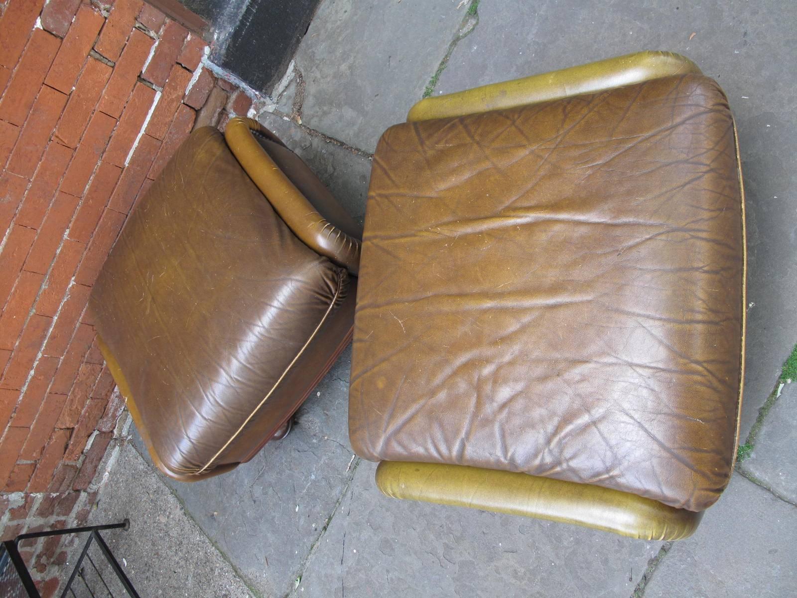 20th century American footstools in olive leather with nailhead details. Available individually.