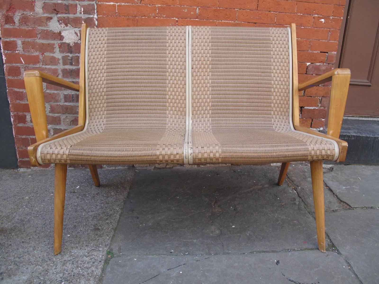 1950s woven bench. Maple frame with original braided and coated fiber seat.