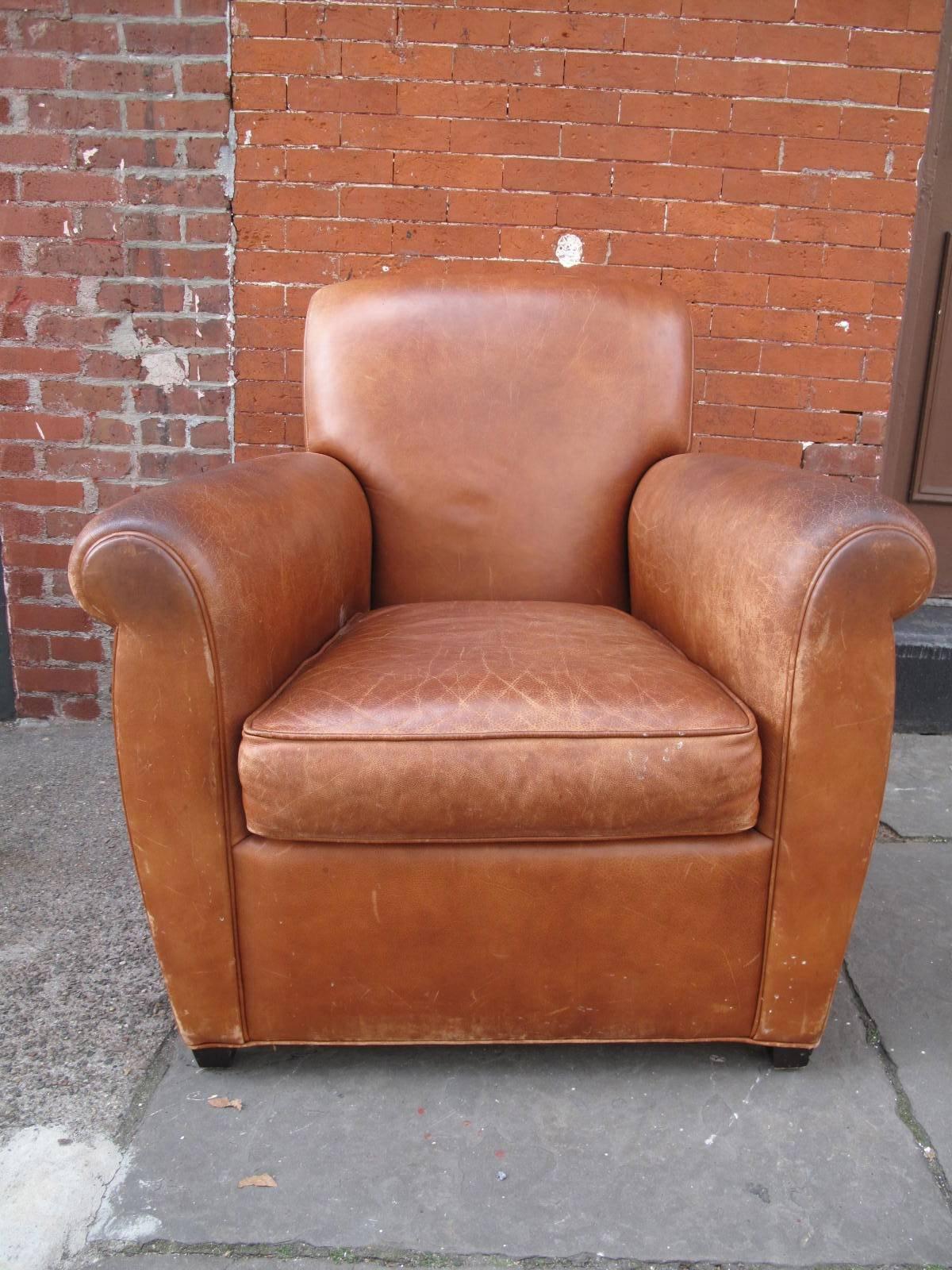 20th century American armchair in coach leather. Manufactured by Baker Furniture.