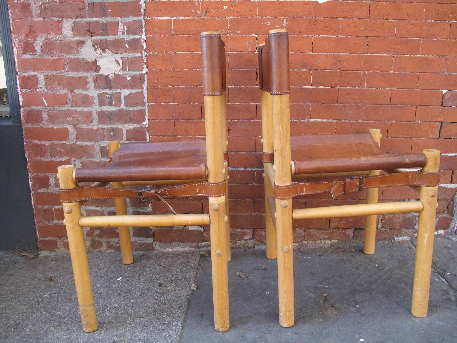 Removable leather seats and backs, held fast by leather straps.

Joints are not glued, with the ability to take chairs apart for transport.

Available as a pair.
