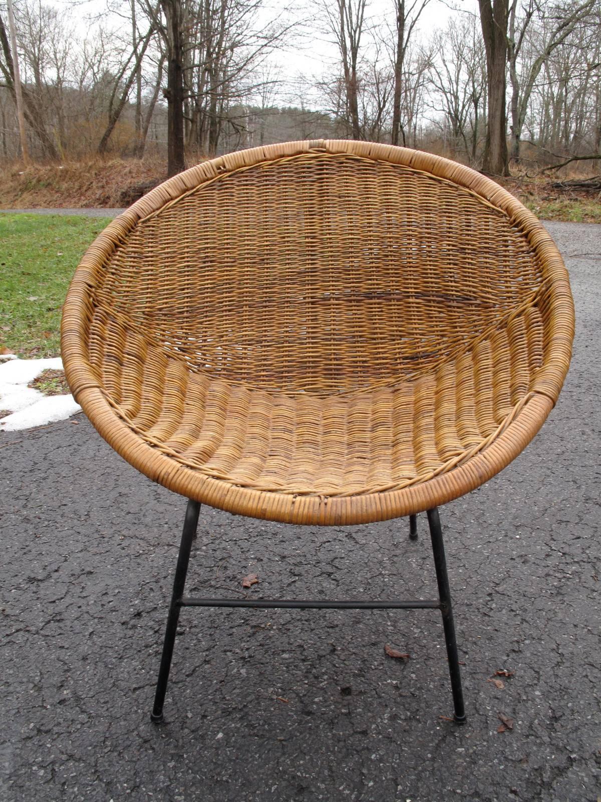 1960s woven rattan chair. Steel base, painted black.
  