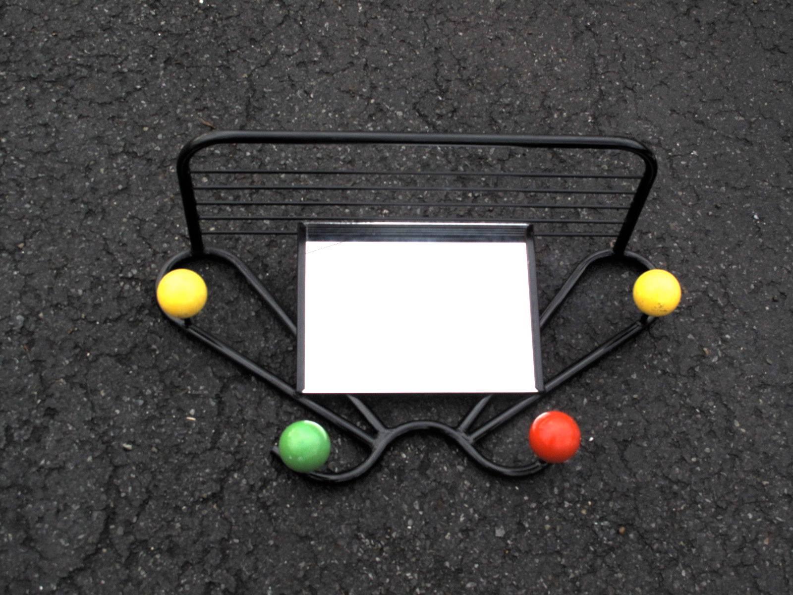 Original midcentury French coat rack, black enameled steel with colored balls acting as individual coat hangers, very reminiscent of the works of Roger Ferraud and George Nelson.