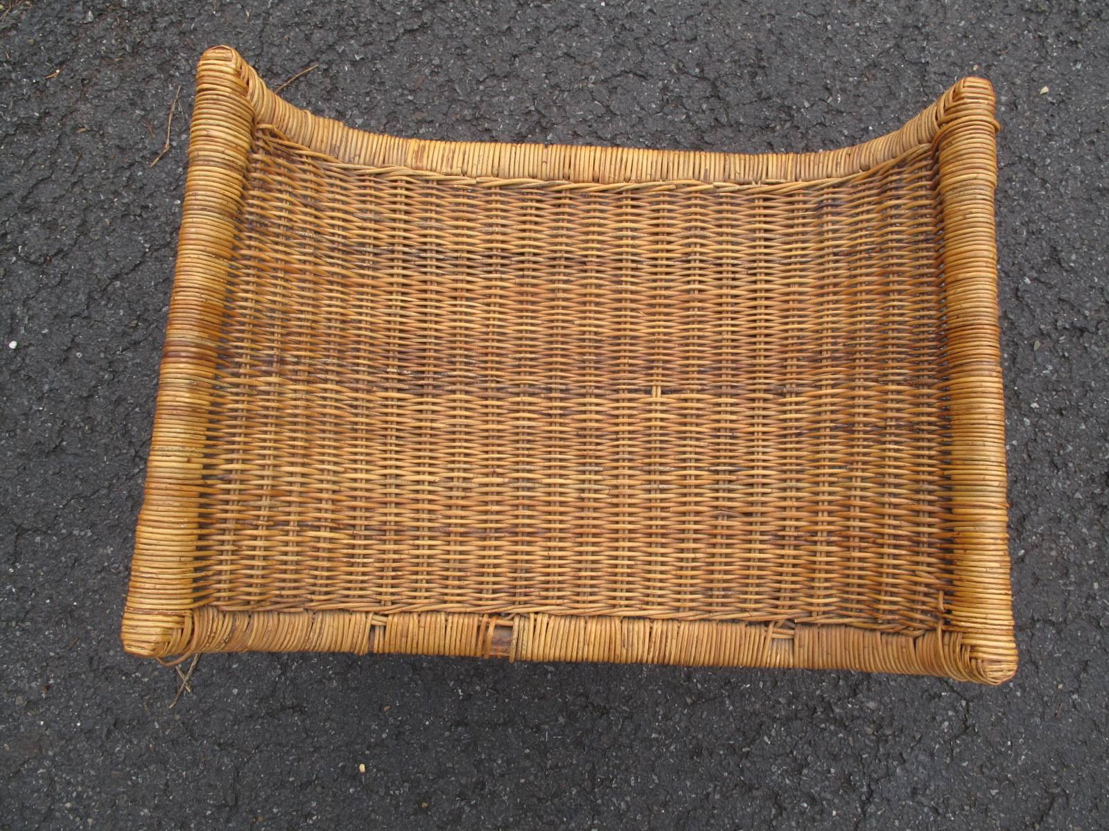 Rattan ottoman with iron base attributed to Danny Ho Fong.