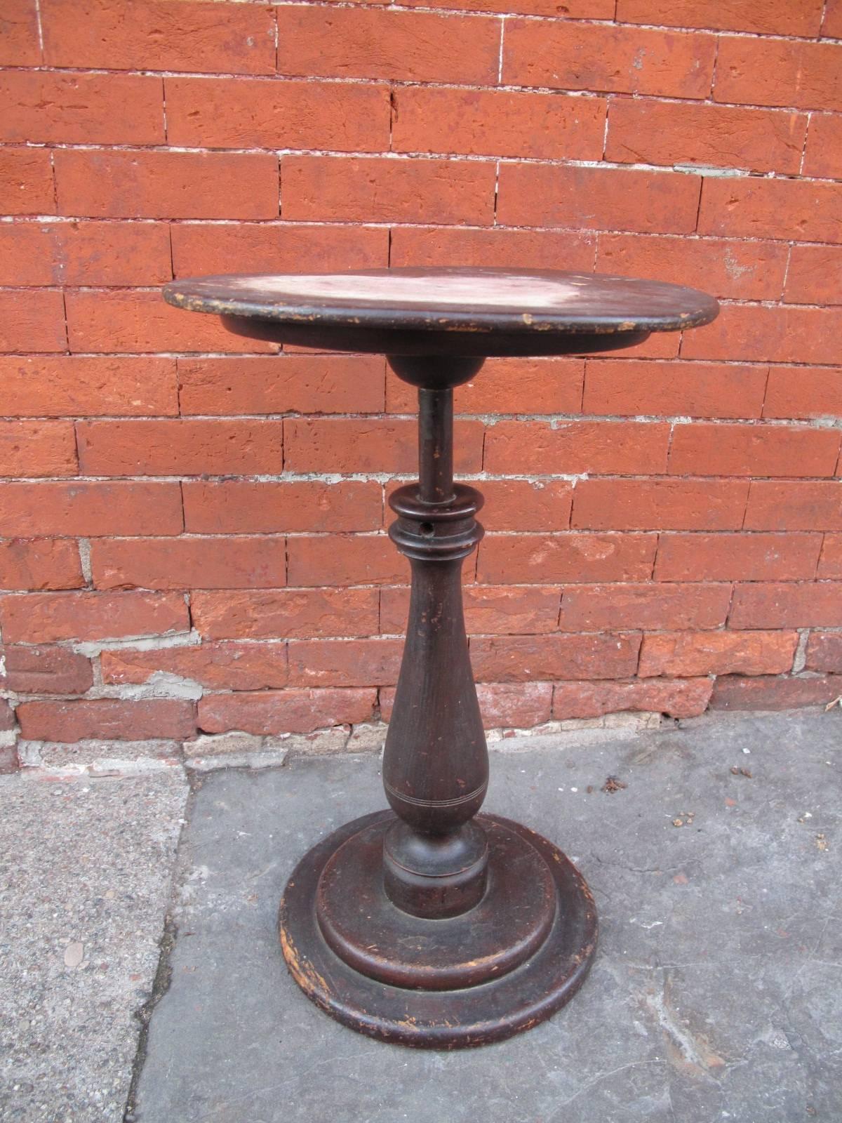 Small end table on turned baluster form base.