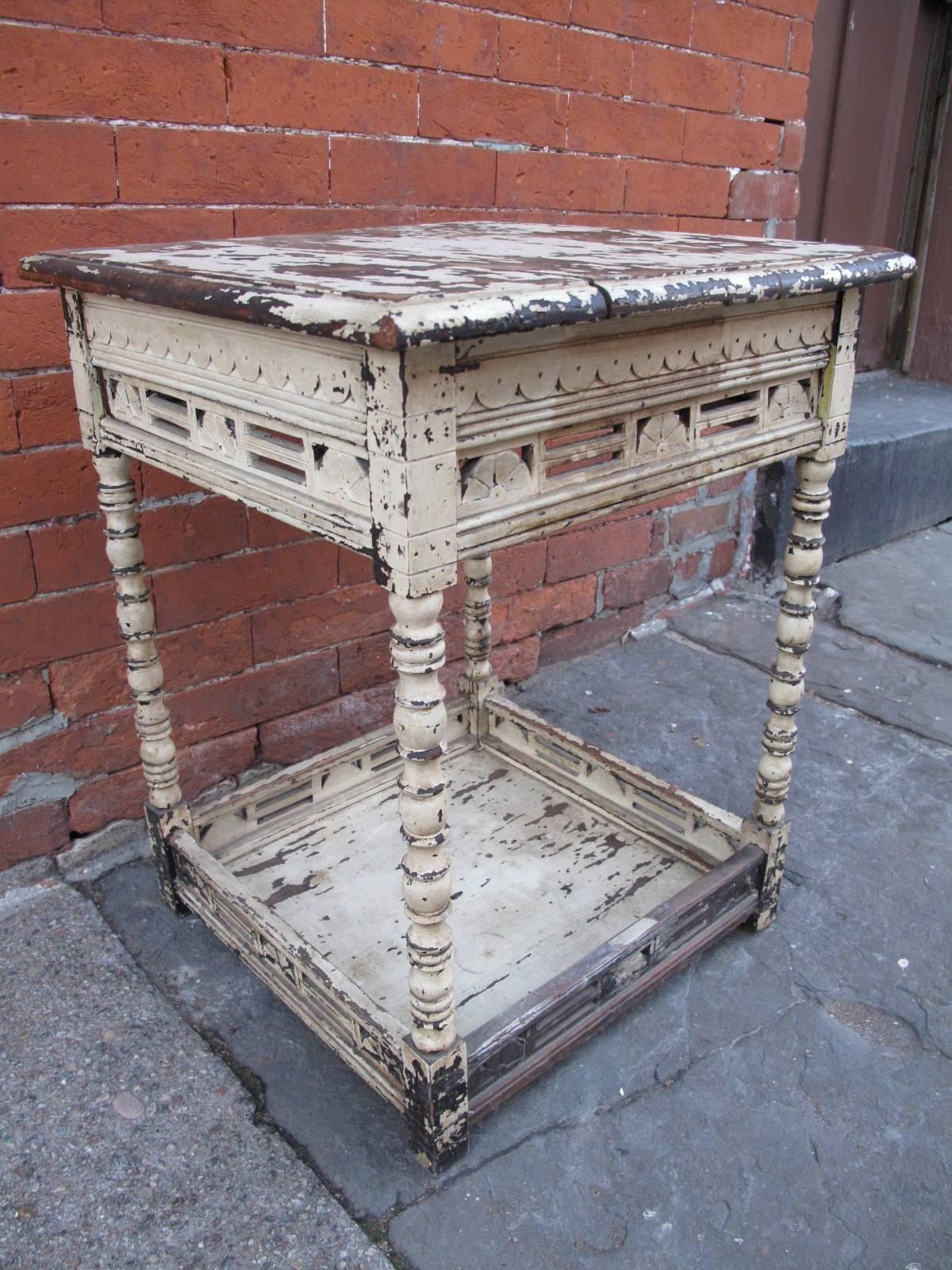 Petite end table with remnants of original white paint. Lovely scalloped carved detail.