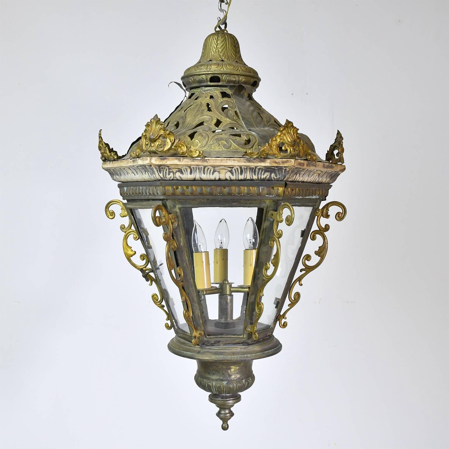A very beautiful and highly decorative pair of Baroque style Belle Époque Gondola Lanterns from Venice in hand-cut and hand-hammered metal with some cast elements, gesso and brass decorative details. Converted to electric, Italy, circa late