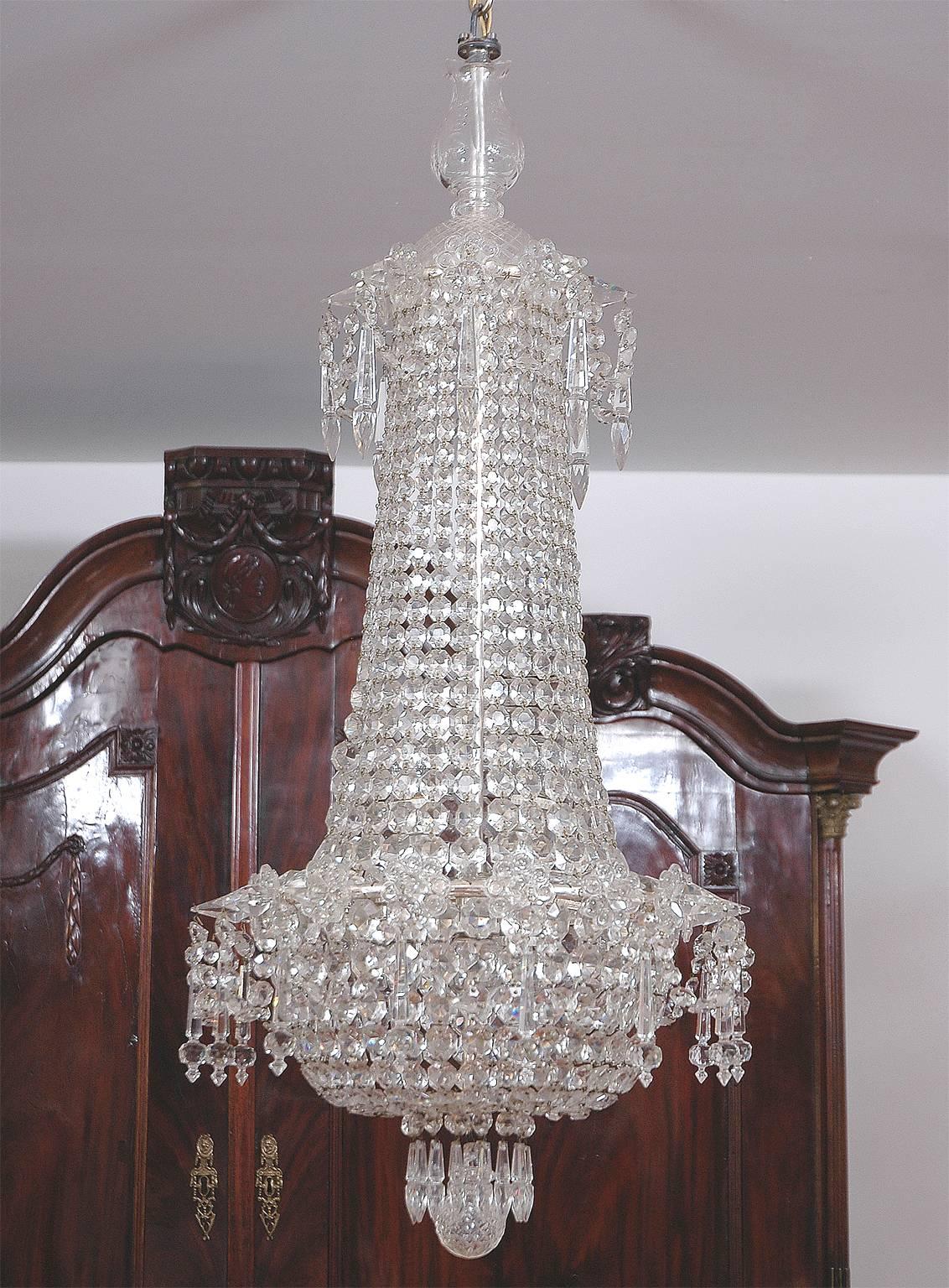 An exquisite bag and tent, Art Deco cut-crystal/glass and chrome frame chandelier with three internal lights, Scandinavia, circa 1930. 
Measures: Drop 39 1/2