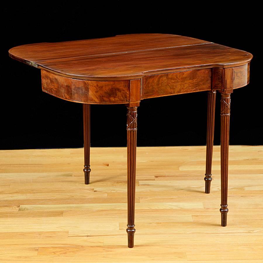 American Sheraton D-Form Game Table in Mahogany with Reeded Legs c.1815

Game tables are a very versatile piece of furniture, they work perfectly in hallways, living and dining rooms, or in bedrooms as decorative narrow tables below a painting or