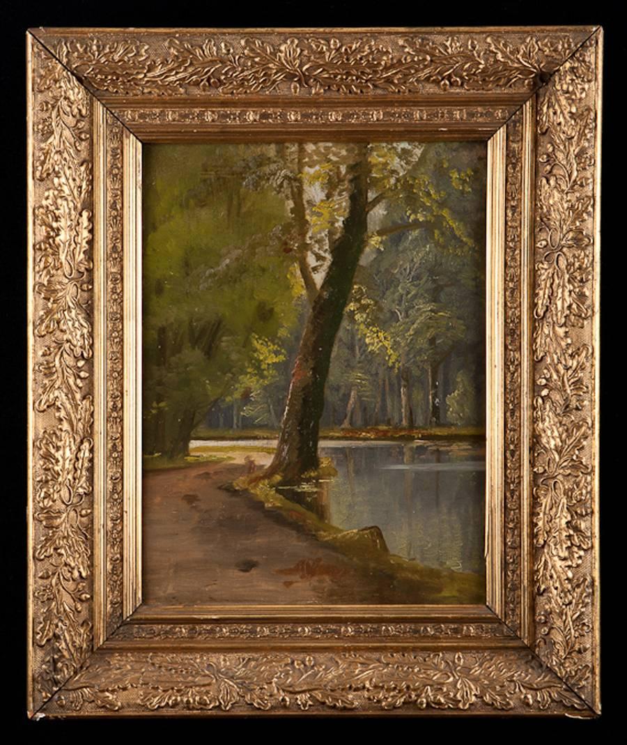 A lovely oil painting on panel of a riverscape scene with sunlight filtering down through the deciduous canopy of a wooded forest amidst a meandering body of water that appears to be a river. Painting has original giltwood frame with beautiful