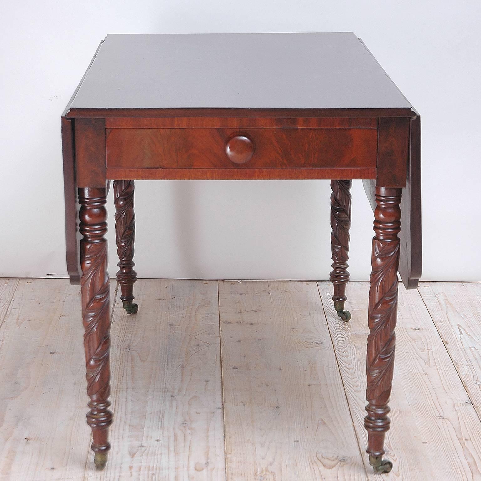 A federal table in mahogany with drop-leaves, on turned legs with large leaf carvings and ending in casters. Offers one drawer with original wooden pull. 
Note: You should always request a shipping quote.
Quoted amounts are an estimate of what it