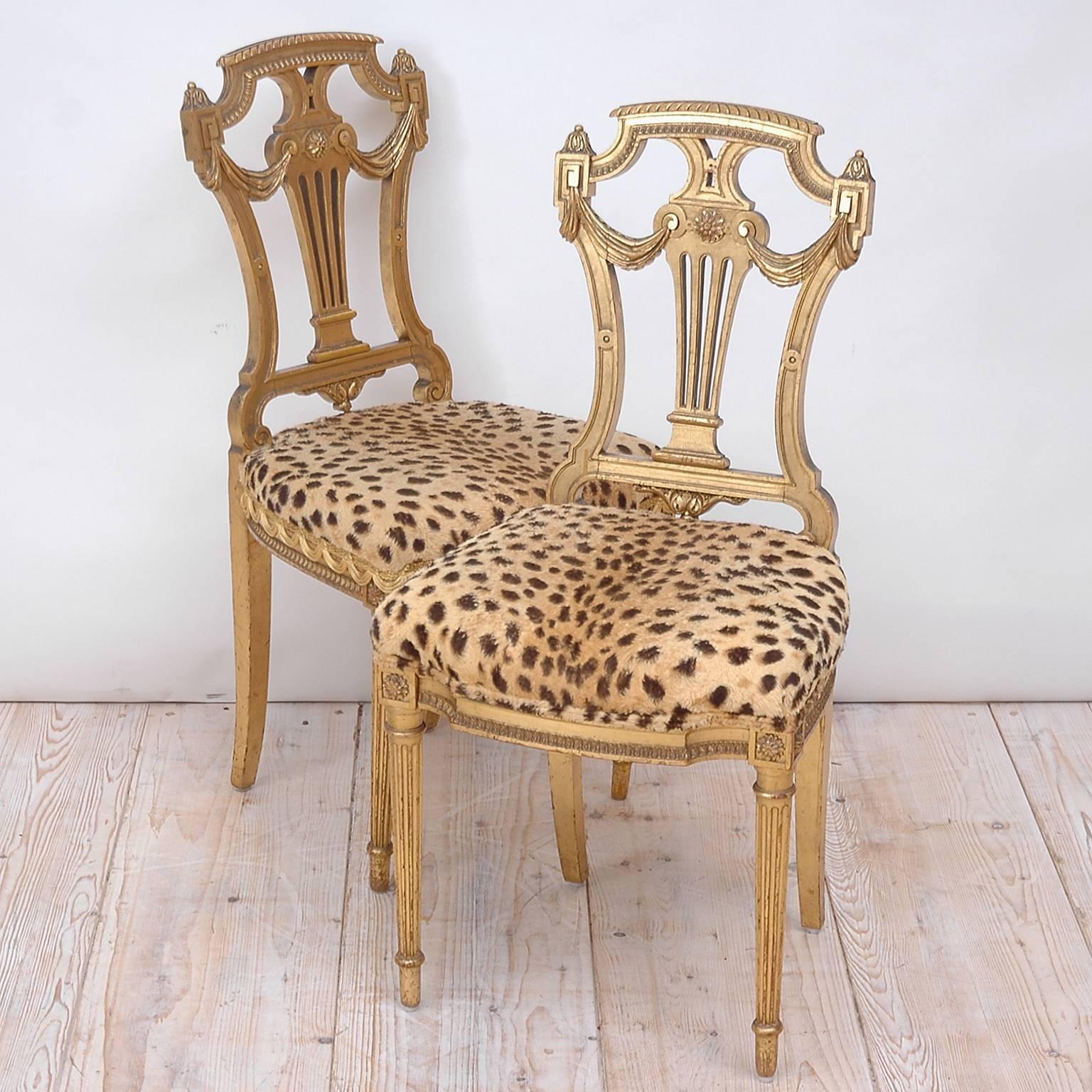 Pair of decorative Louis XVI Style side chairs in carved and gilded wood with leopard fabric, circa 1920s. 

Note: Joints need to be tightened which is best done when the chairs are being re-upholstered.

18