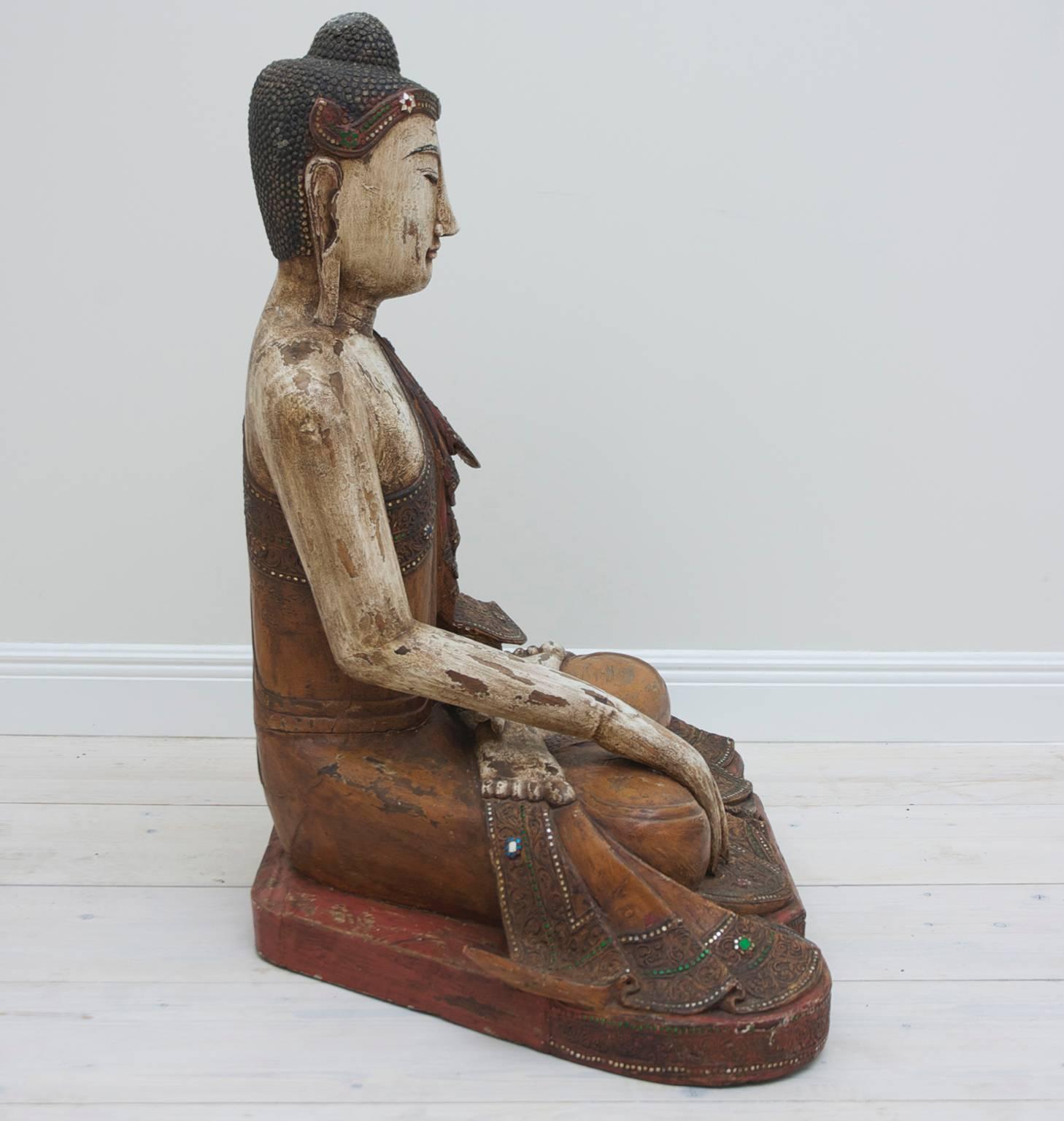 20th Century A large well Articulated Burmese Mandalay Buddha in Carved Polychromed Wood