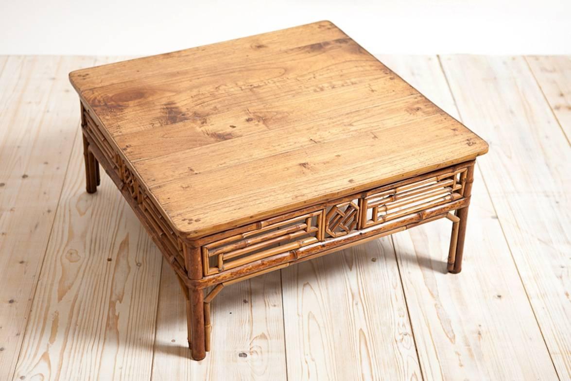 A bamboo and elm kang table in its original height with a beautiful and rich patina. Makes for a lovely small coffee table or an ottoman used with a cushion above it! China, circa early 1800s. 

Measures: 28