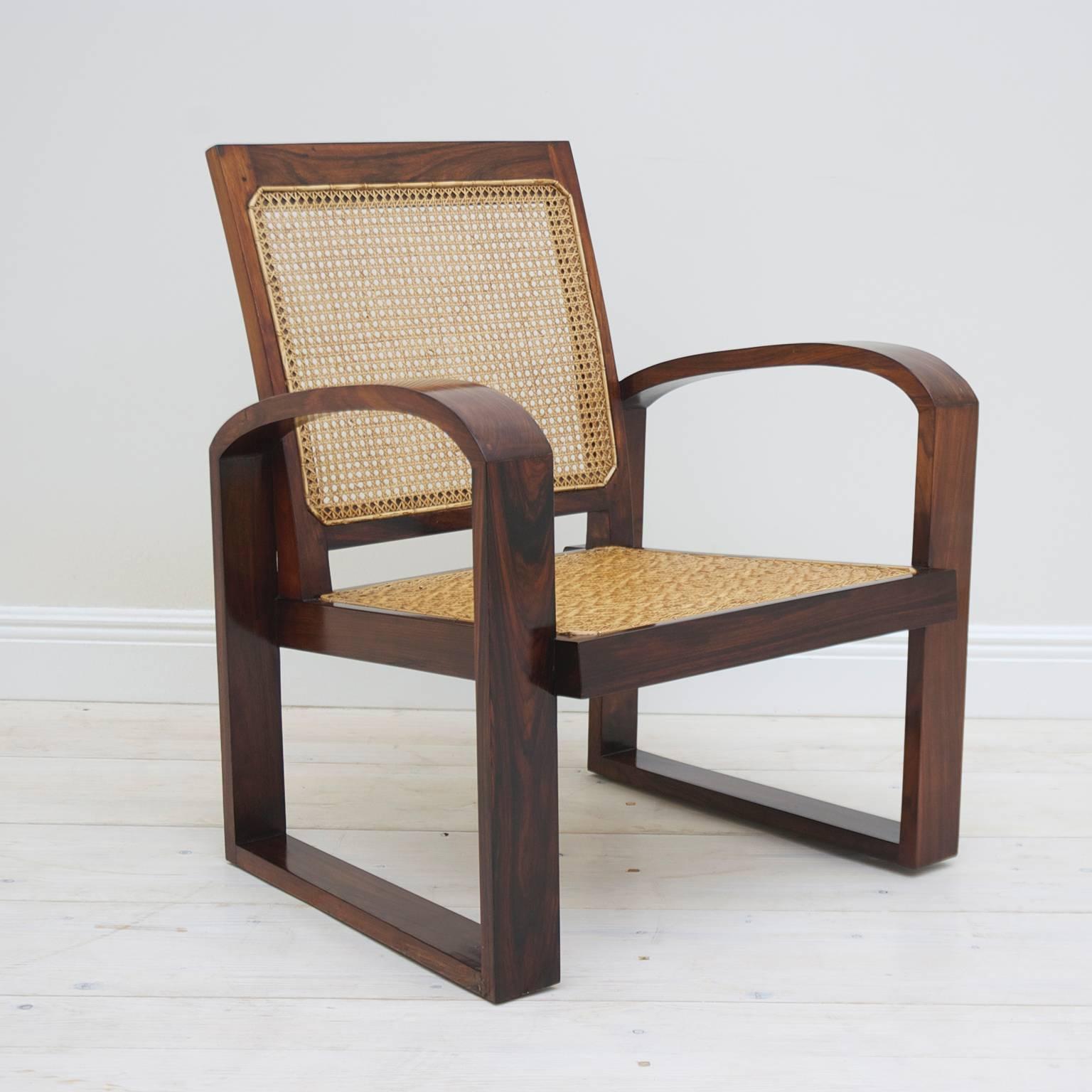A striking set of four Art Deco French Colonial rosewood armchairs with wide woven seats and woven cane-backs on a rosewood frame. Offers comfort and beauty! French colonial Viet Nam, 1920's

27