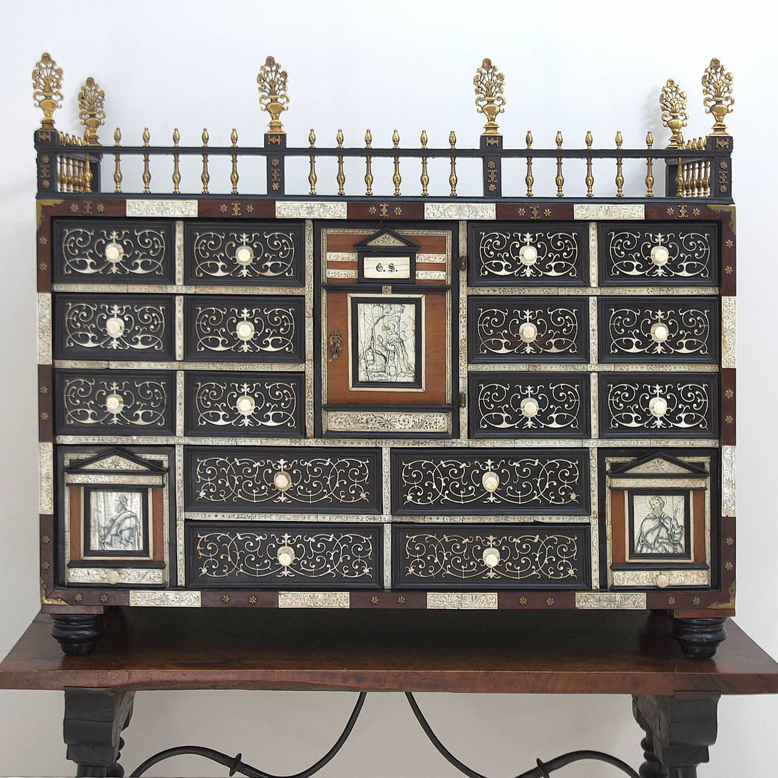 18th century Spanish-Italian bone and ebonized Vargueño seated on a traditional turned ebonized base with walnut top and wrought iron supports. 
The Vargueño table and chest originated in Bargas Spain in the provence of Toledo and is the most