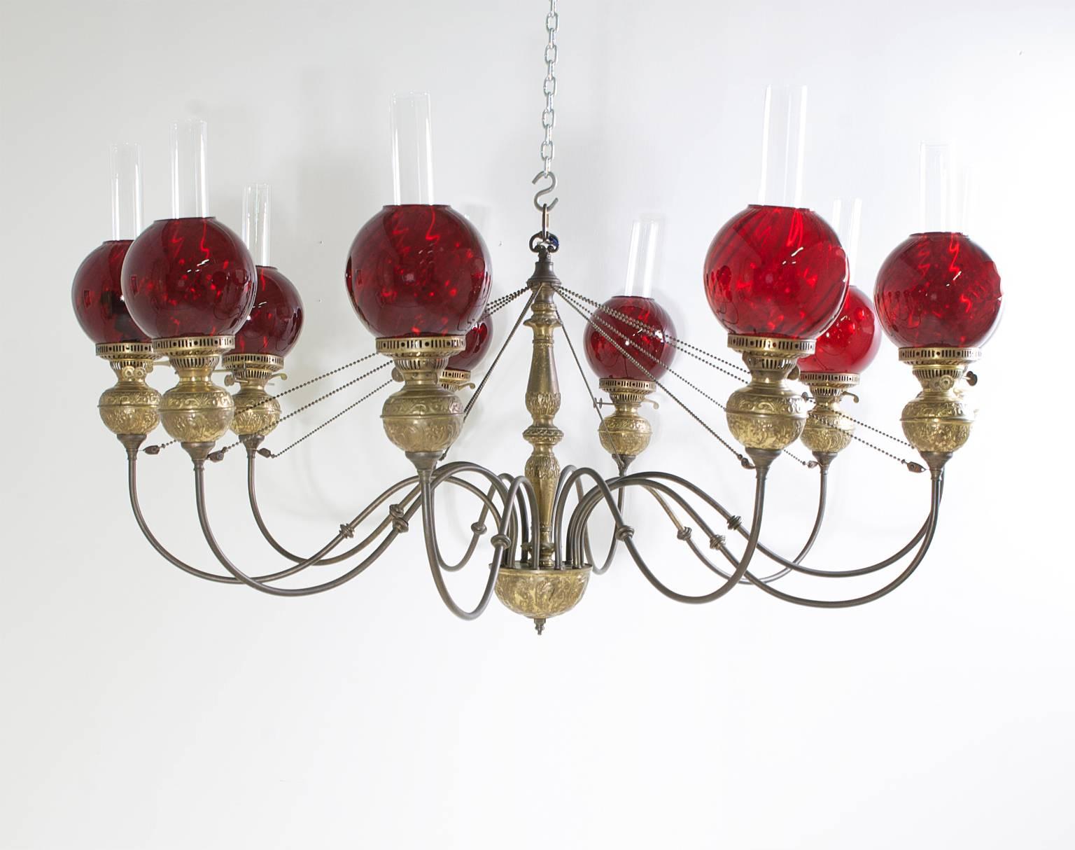 Hammered English Victorian Ten-Light Chandelier in Brass with Cranberry Glass Globes