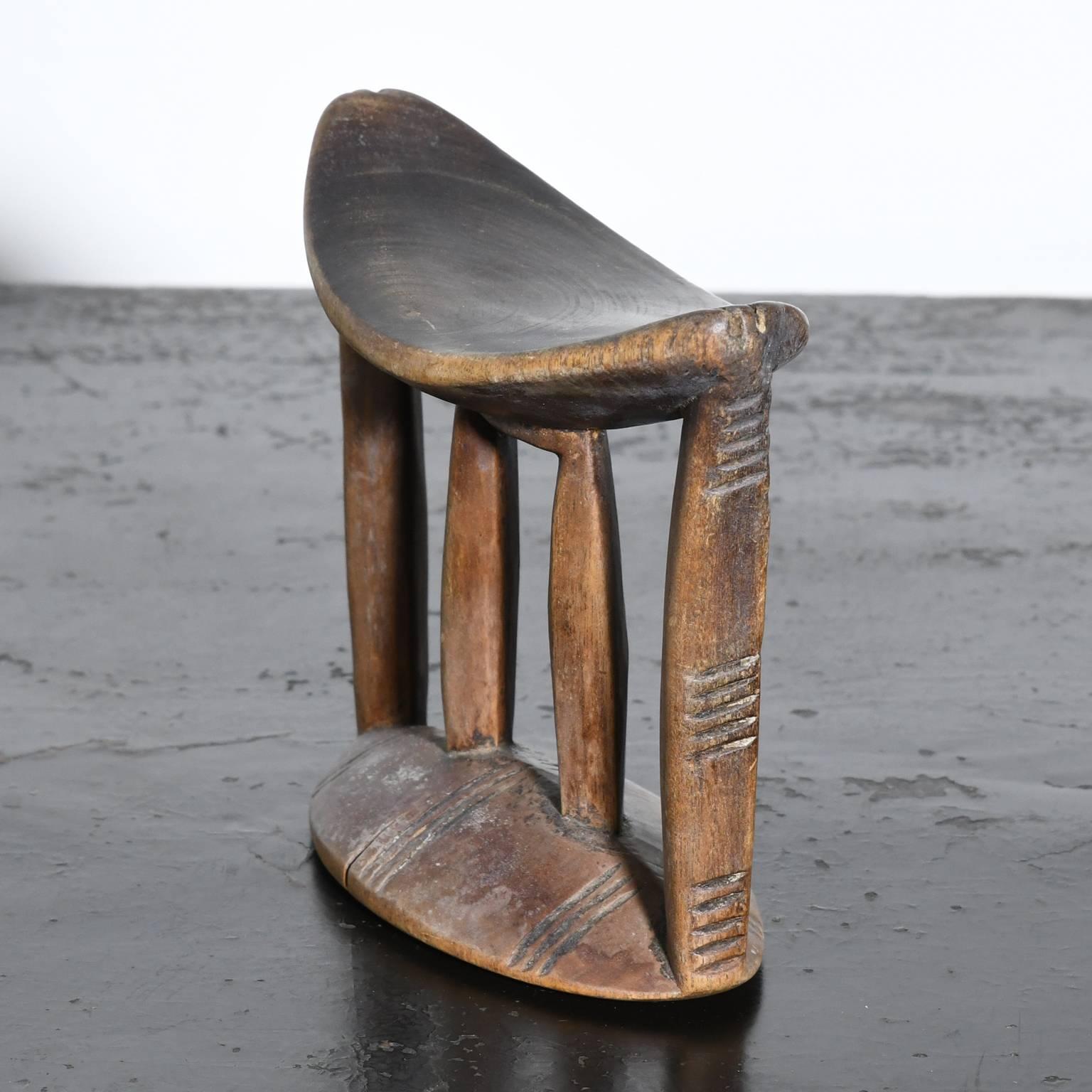 A Traditional Primitive Sidamo headrest with simple incised lines from the Sidamo people of Ethiopia. It is impossible to accurately date these objects without a provenance which is rare. Headrests are part of an ongoing tradition. We can only look