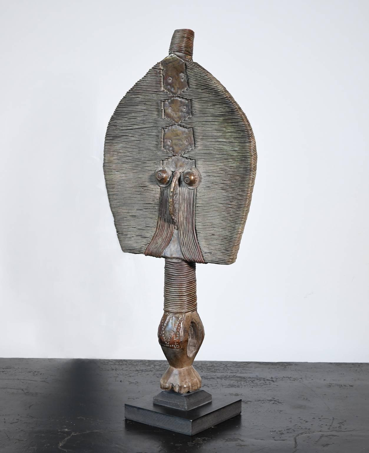Traditional Bakota reliquary Guardian figure from the Kota People (Mahongwe Tribe), Gabon Africa probably dates from the early 20th century or is possibly older. It is difficult to ascribe a specific date to these reliquary masks. However,