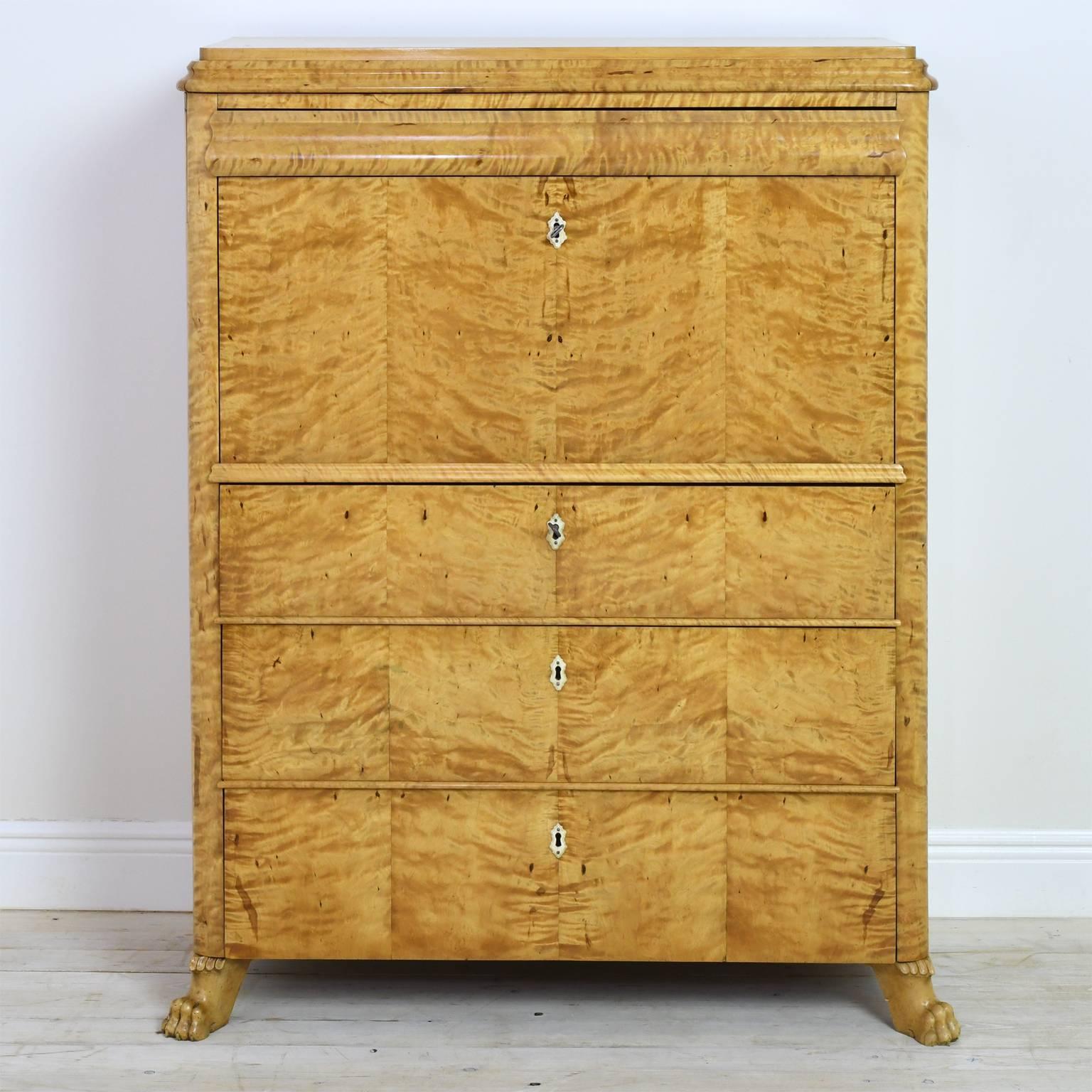 From the Swedish Empire period under the rule of King Carl Johan of France, this handsome Antique Biedermeier Fall Front Secretary, circa 1830 is a wonderful example of form meeting function. 
It features a flight of 3 large drawers below the fall