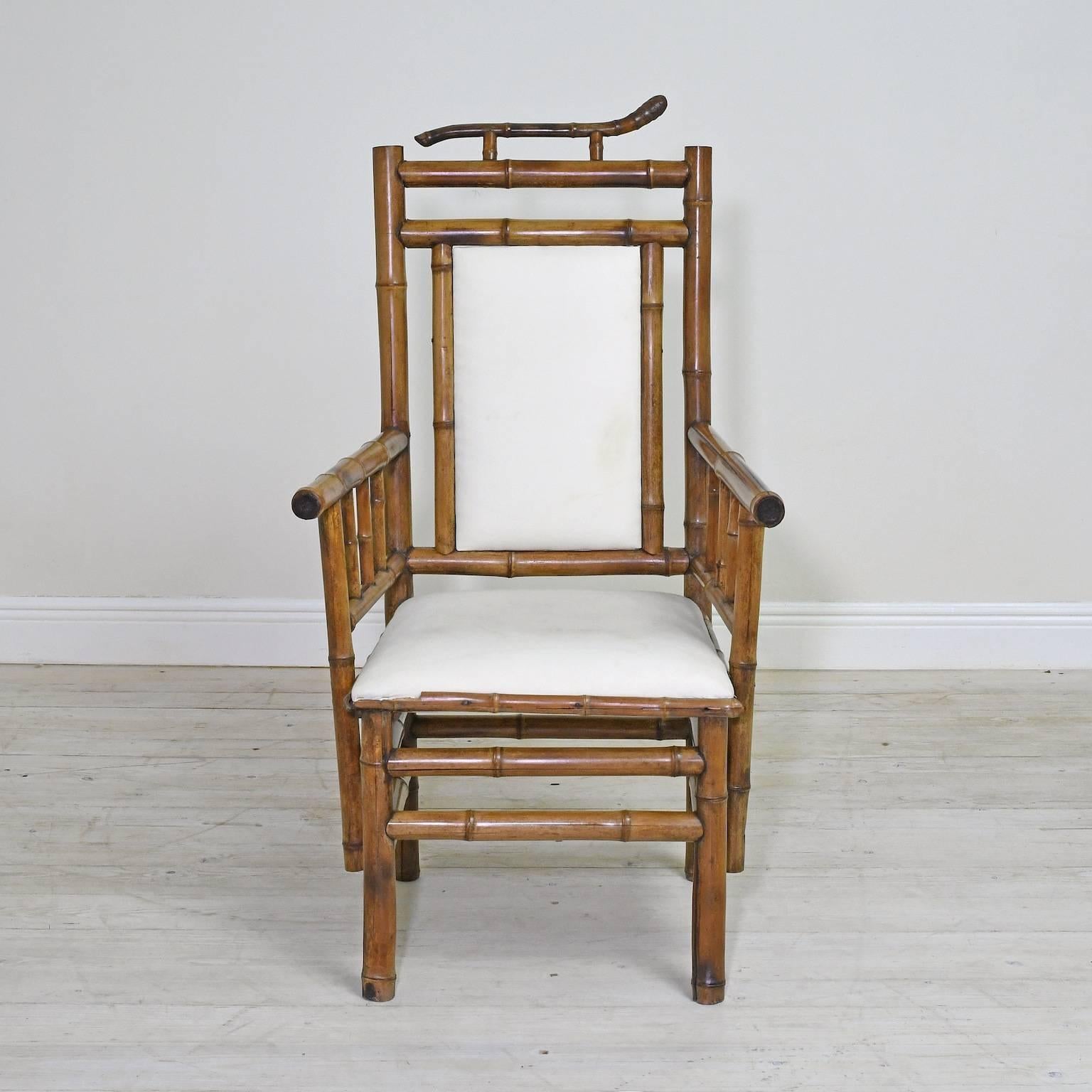 A striking pair of lounge chairs with bamboo frames, upholstered seat and back, French Indochina, circa 1900.
These chairs are very appealing with their tall backs and linear look!

Measures: 26