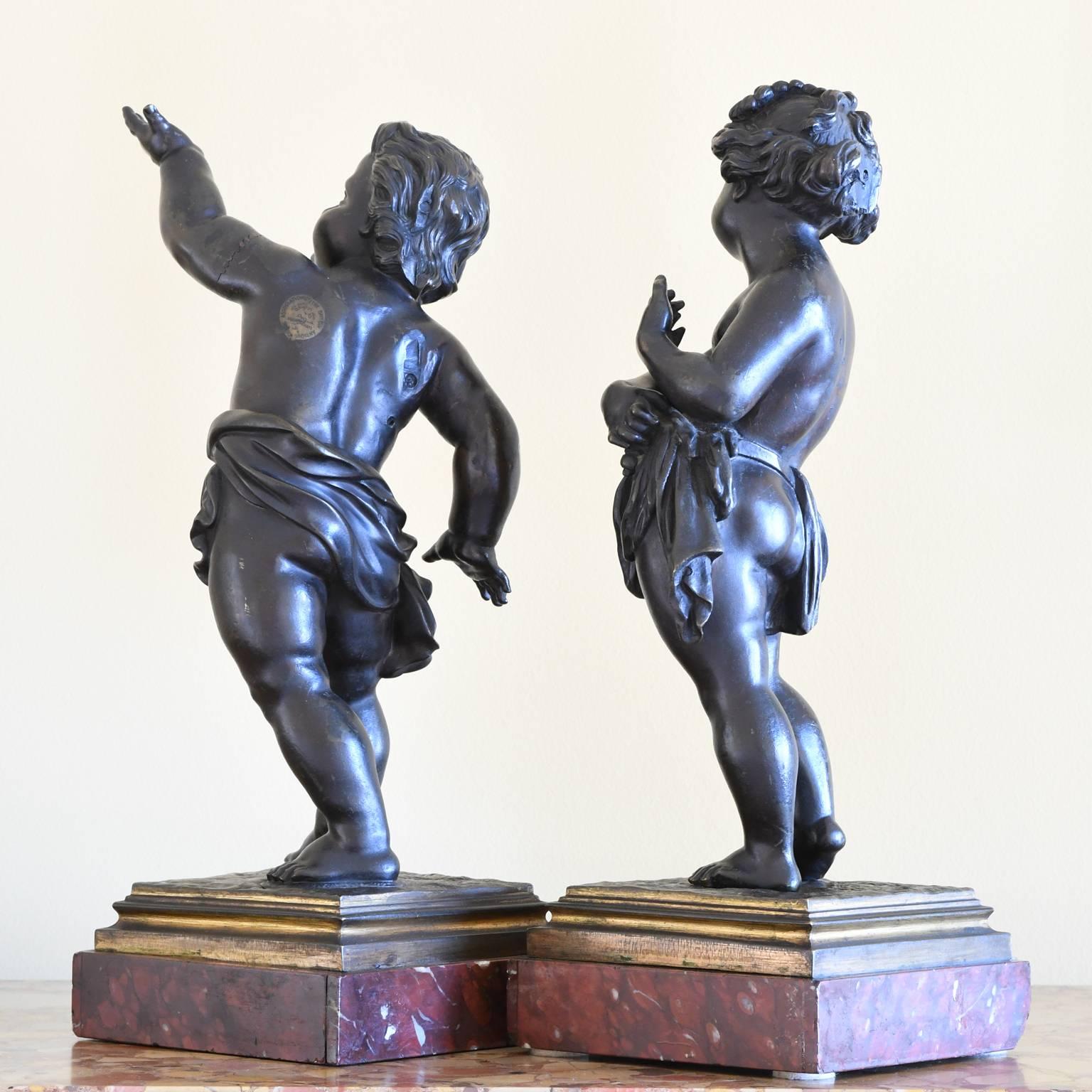 Cast Pair of 19th Century French Bronze Cherubs on Marble Base For Sale