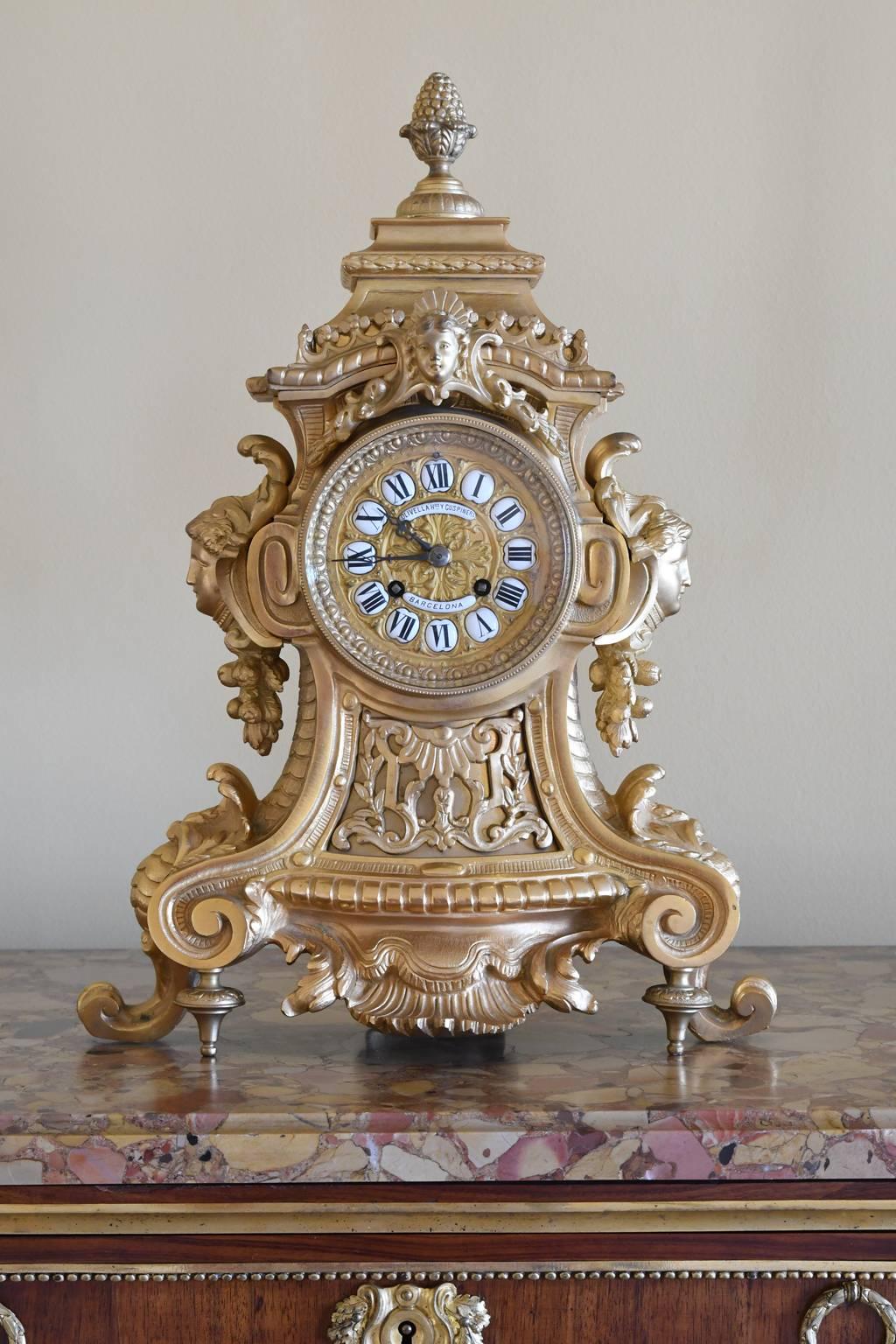 A very lovely Rococo-style mantel clock in bronze doré with enamel Roman numerals on the dial. Made in France for the firm of Olivella Hermanos & Cuspinera in Barcelona, Spain, during the Belle Époque period, France, circa 1890.
Clock is