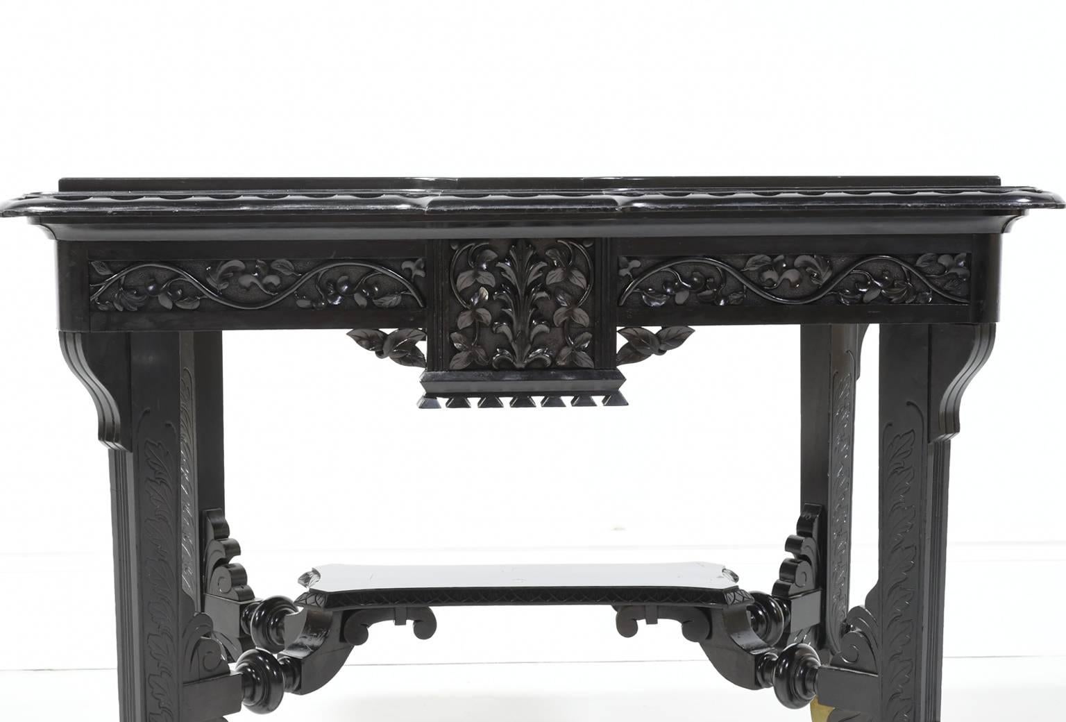 Aesthetic Movement Centre Table in Carved Ebonized Wood with Brass Feet, c. 1870 2