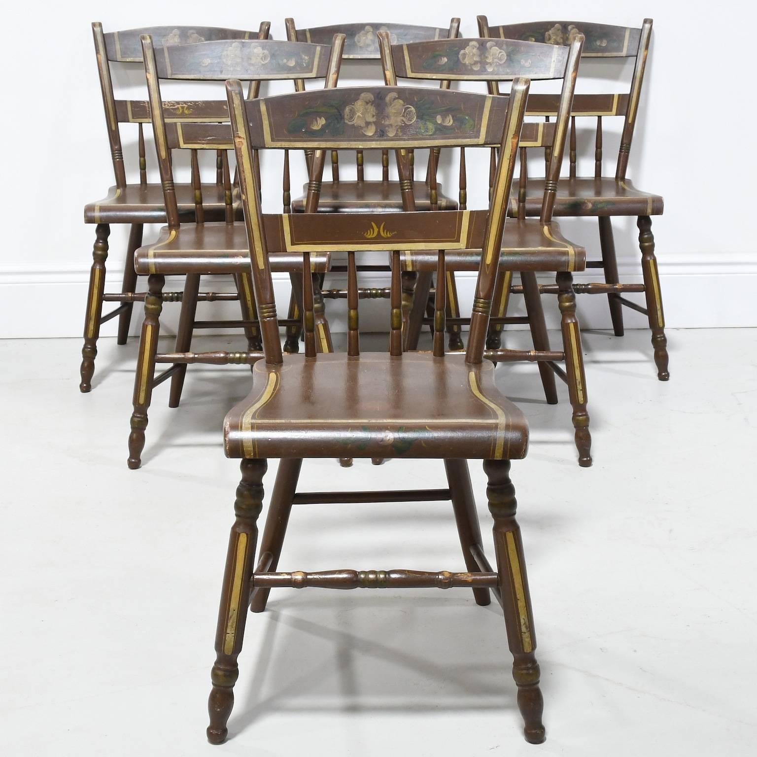 A beautiful collection of six Pennsylvania 1/2 spindle back plank seat paint decorated chairs from Ephrata area in Lancaster County Pennsylvania dating from the mid to late 1800s. Note the worn styles on all chairs where the chairs would have been