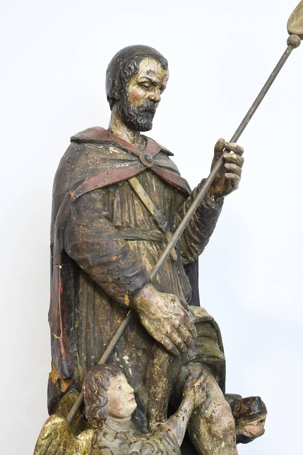 Early 18th Century Carved Polychromed Statue of Saint Roch with Dog and Angel In Distressed Condition In Miami, FL