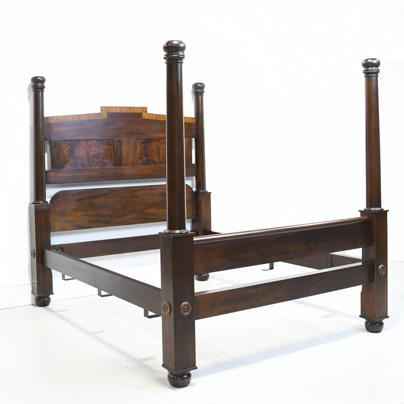 An American Empire or Federal style queen-size bed with four posts in the manner of North Carolina cabinetmaker Thomas Day. This bed was produced by Craftique in the mid to late 1990s and was part of their Heritage Collection.

Measures: 69