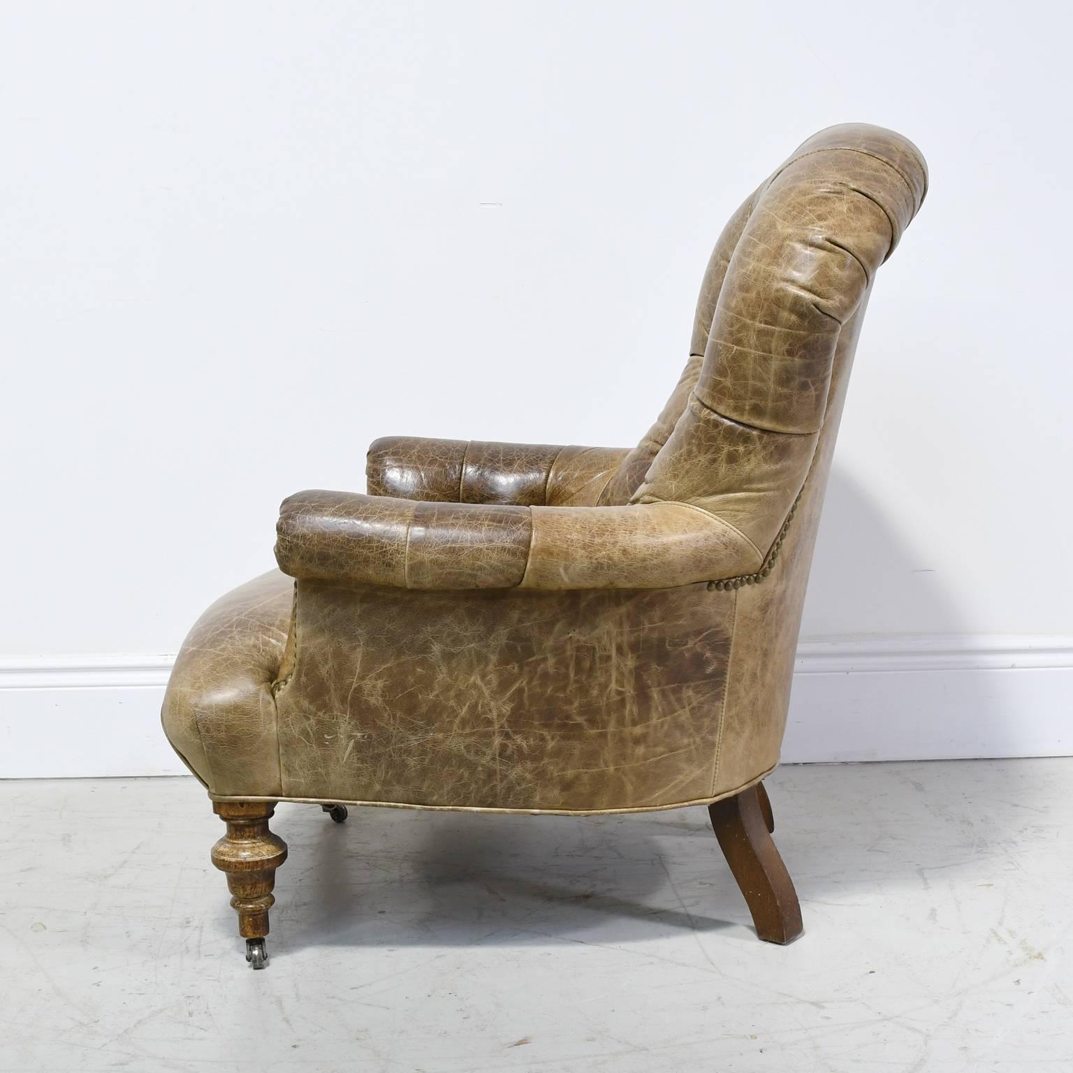 Napoleon III Worn Brown Leather Club Chair with Scrolled Arms, Tufted Back and Turned Feet