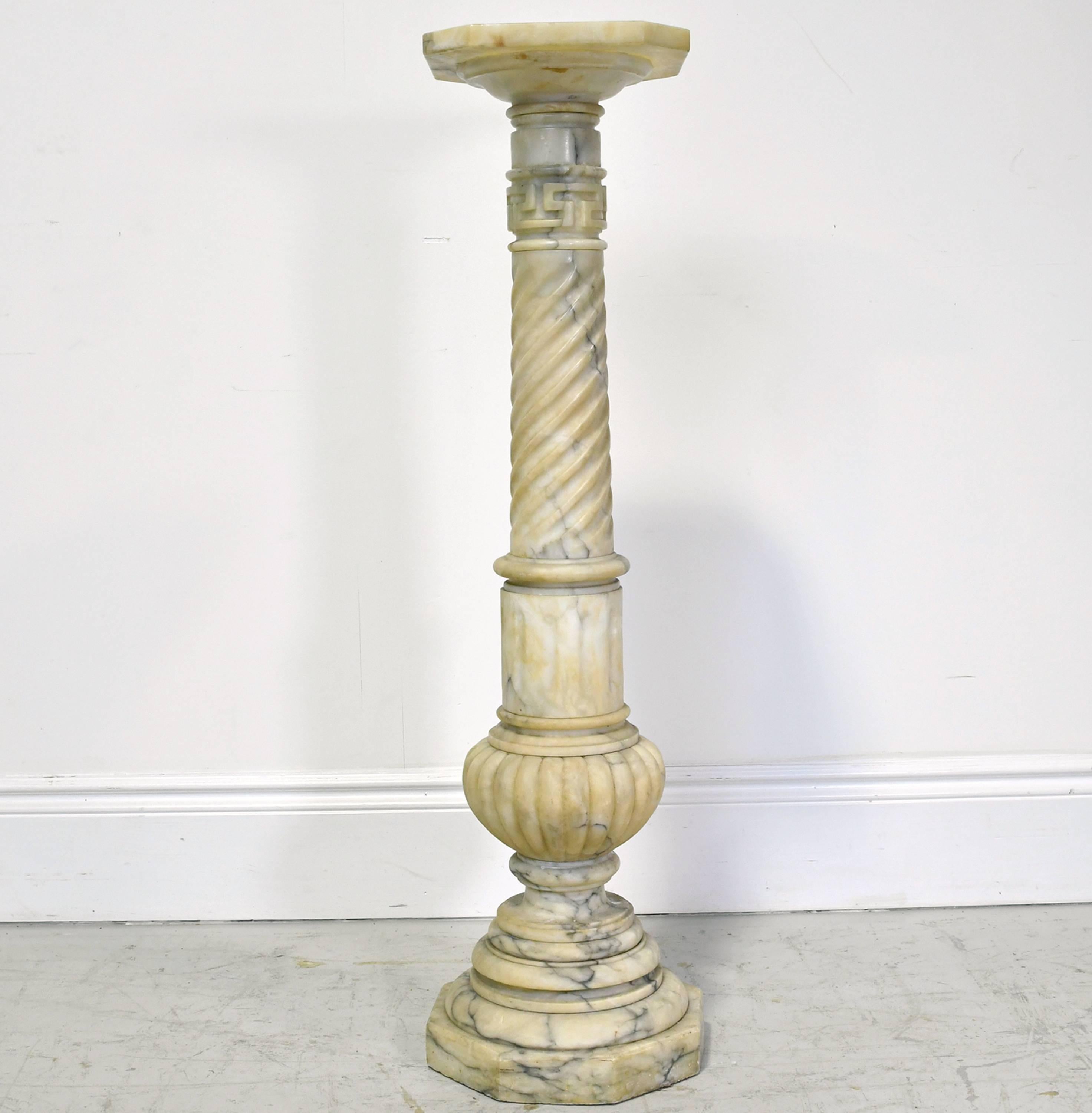 A very beautiful second Empire turned and carved alabaster pedestal from the reign of Napoleon III, France, circa 1860. Color is an off-white with yellow shadows and grey veining. Features a carved Greek key at the top of the pedestal.
Top measures: