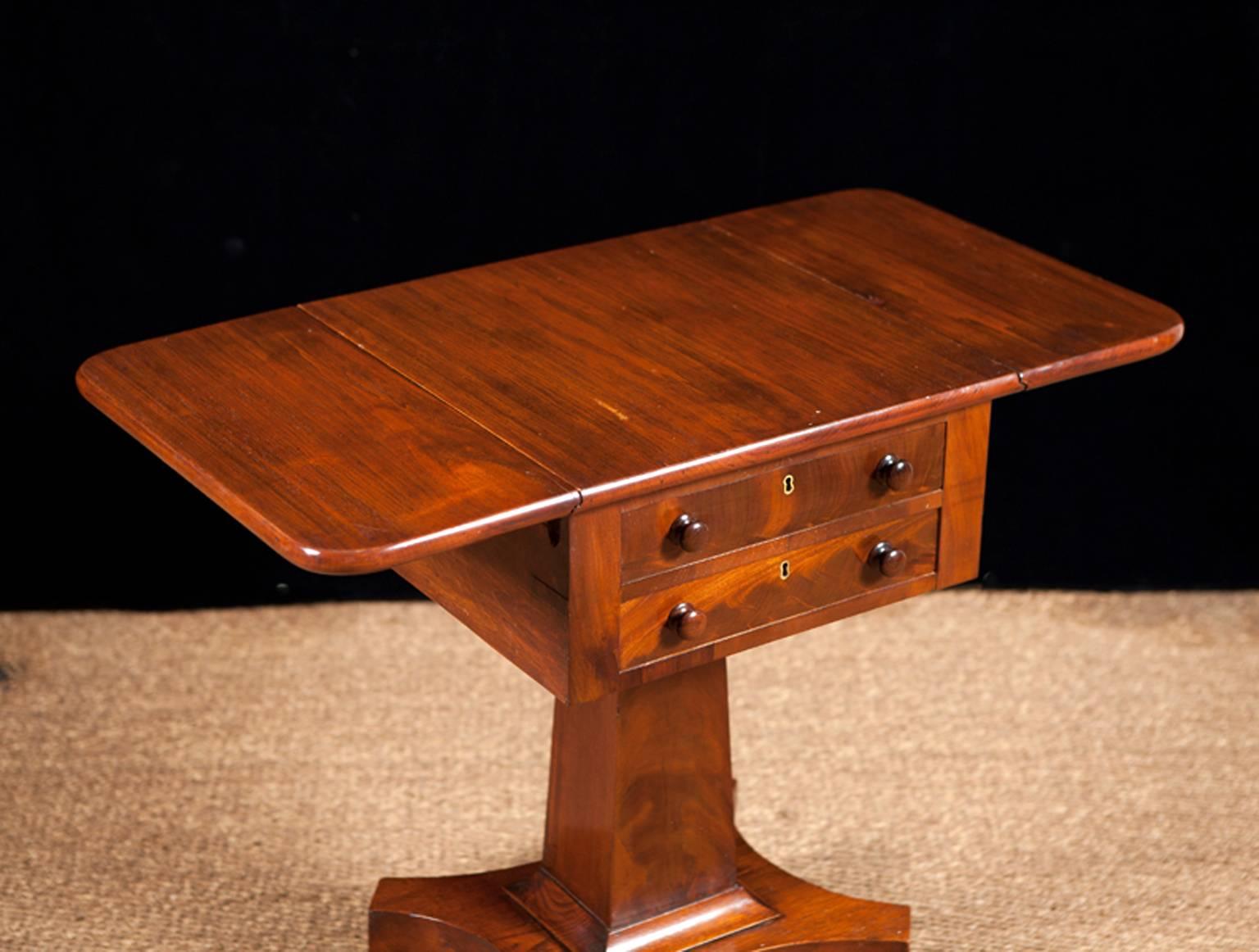 American Empire mahogany two-drawer work table with fold down Pembroke leaves, c. 1840.
Measures: 18