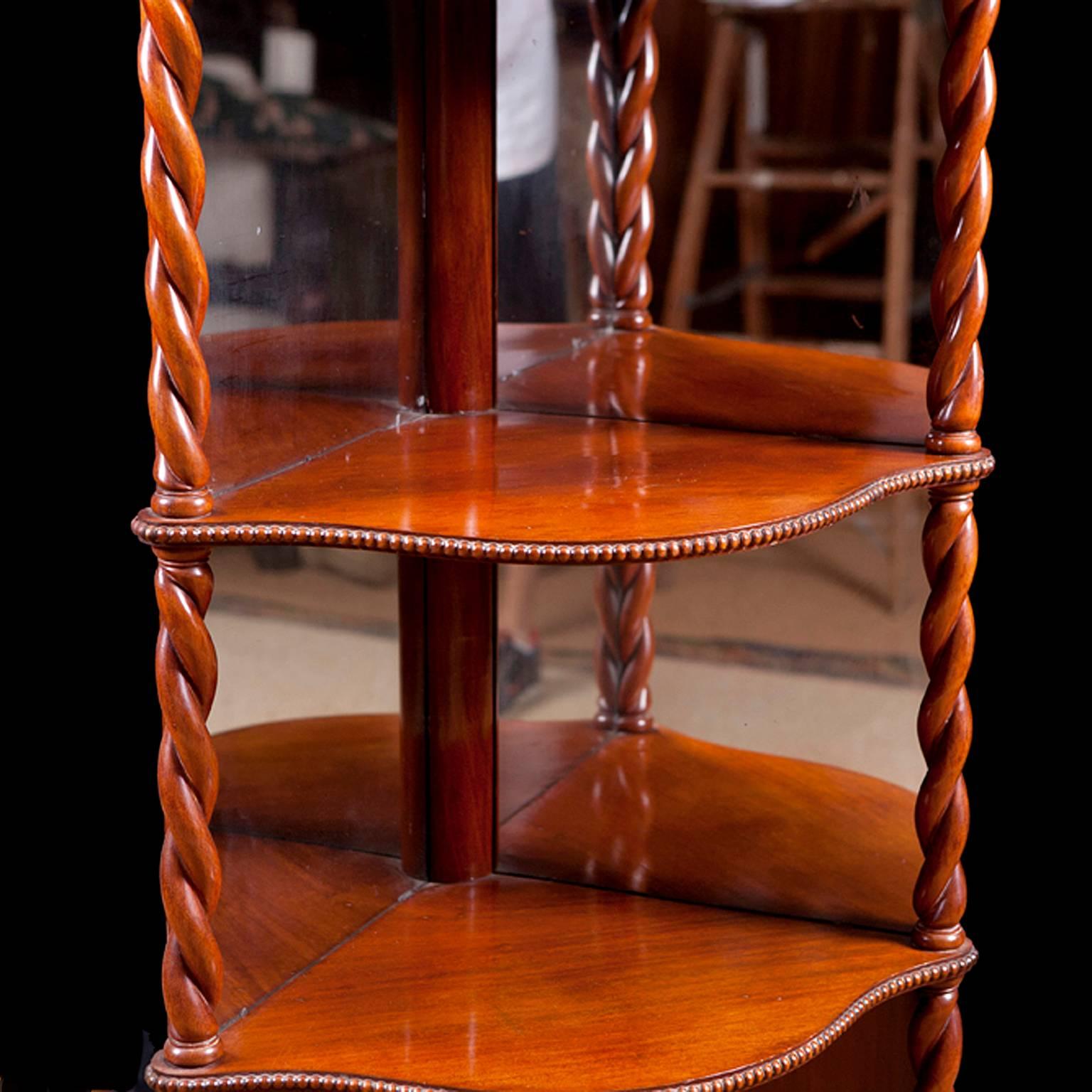 A lovely what-not or étagère in mahogany with rope turnings, beading on shelves and original mirrored-back, Danish, circa 1835.

Measures: 22