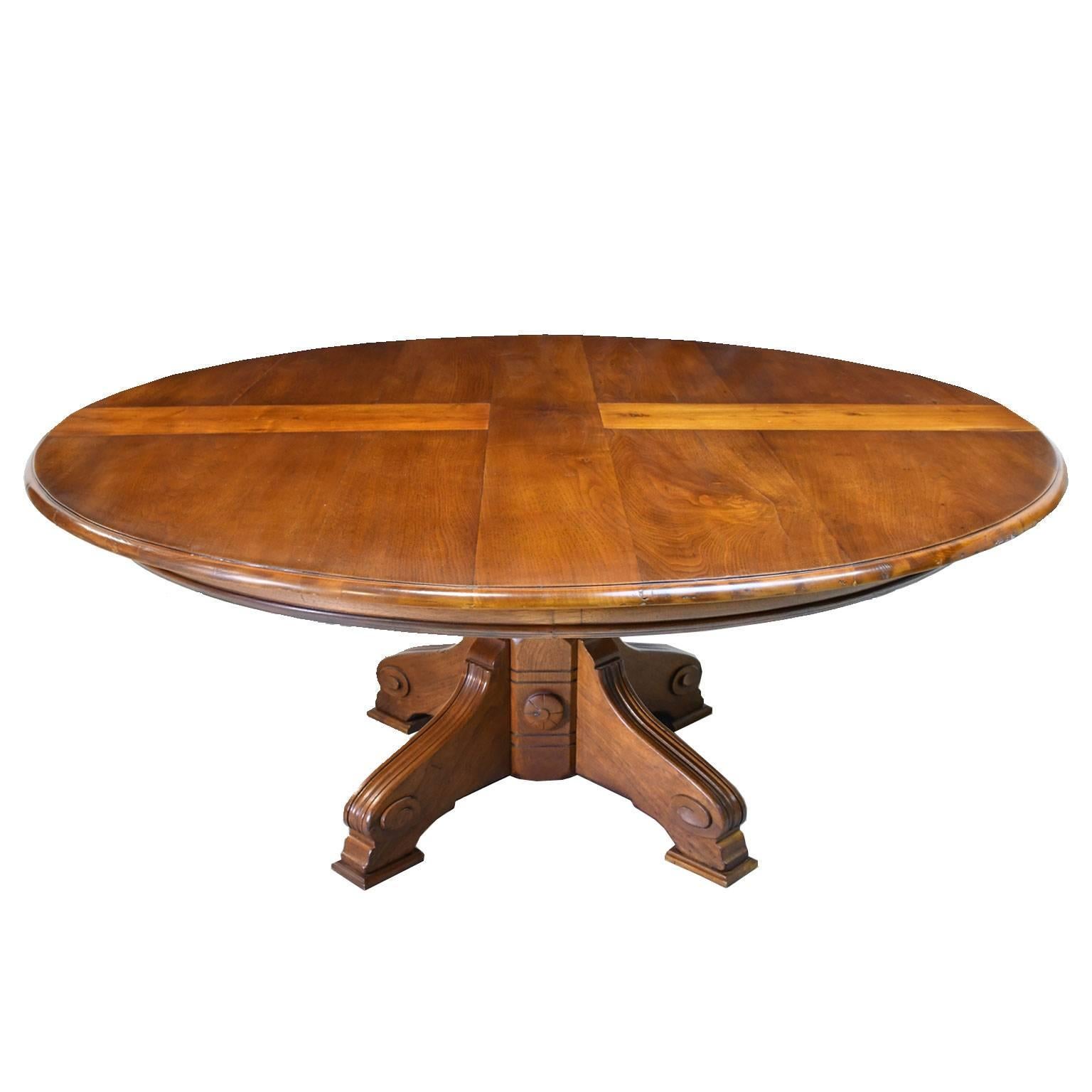 A very handsome American Aesthetic Movement dining table in solid walnut with large round top resting on carved pedestal base. Hand-rubbed oil finish, circa, 1880. Top is finished with an organic LEED certified oil finish. Depending on the chairs,