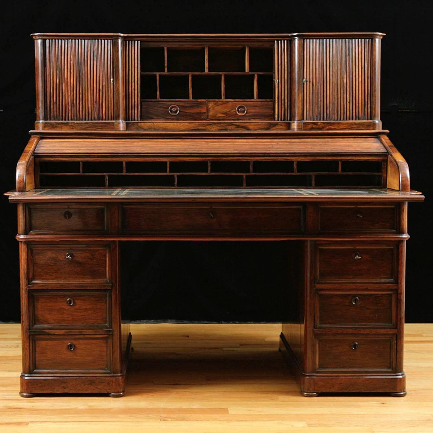 Museum quality Napoleon III pedestal base with tambour roll-top desk in rosewood, France, circa 1860. Desk is finished on both sides and can float in a space or be placed against a wall. Cabinet doors on back side (see image.) Desk has new leather