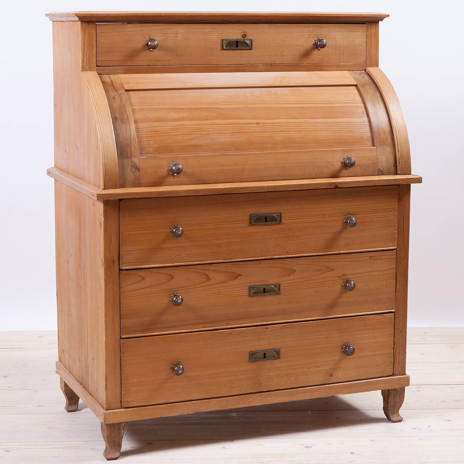 North German Provincial Biedermeier Secretary in Pine with Cylinder Top. A rare cylinder top pine secretary with Birch wood interior drawers, original pulls and birch pull out writing surface. Drawer pulls are turned fruit wood with nickle plated