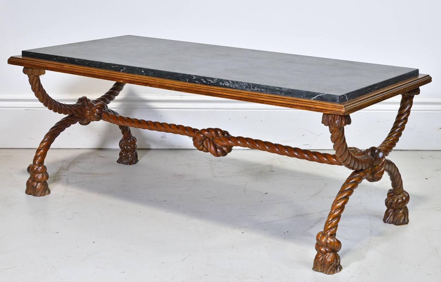 French Antique Marble Top Coffee Table. Mid 20th century Napoleon III style carved rope and marble coffee table in the manner of A.M.E. Fournier. Frame is carved to look like knotted and tassled ropes. A.M.E. Fournier furniture company was