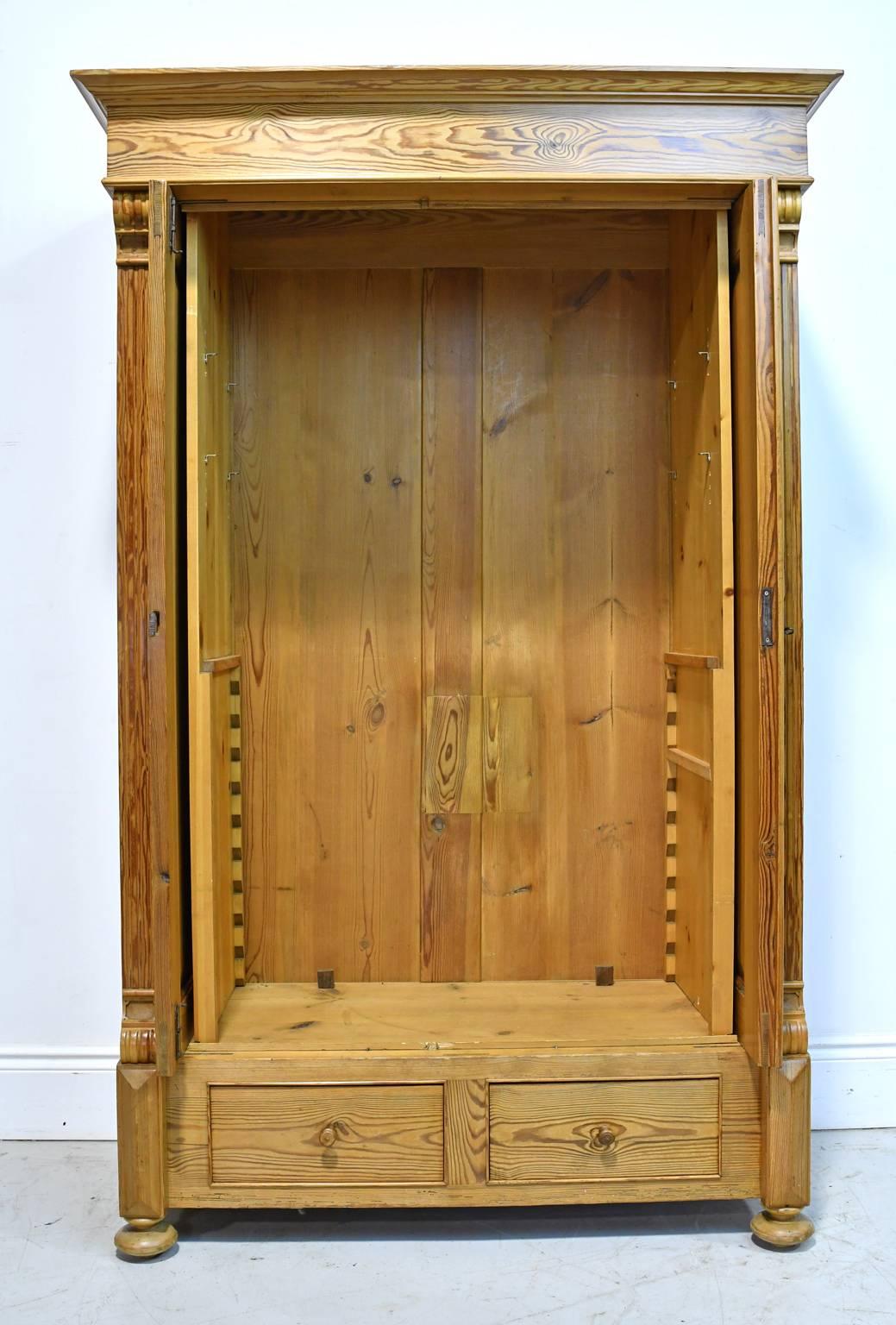 German 19th Century European Two-Door Pine Armoire with Drawers and Retractable Doors