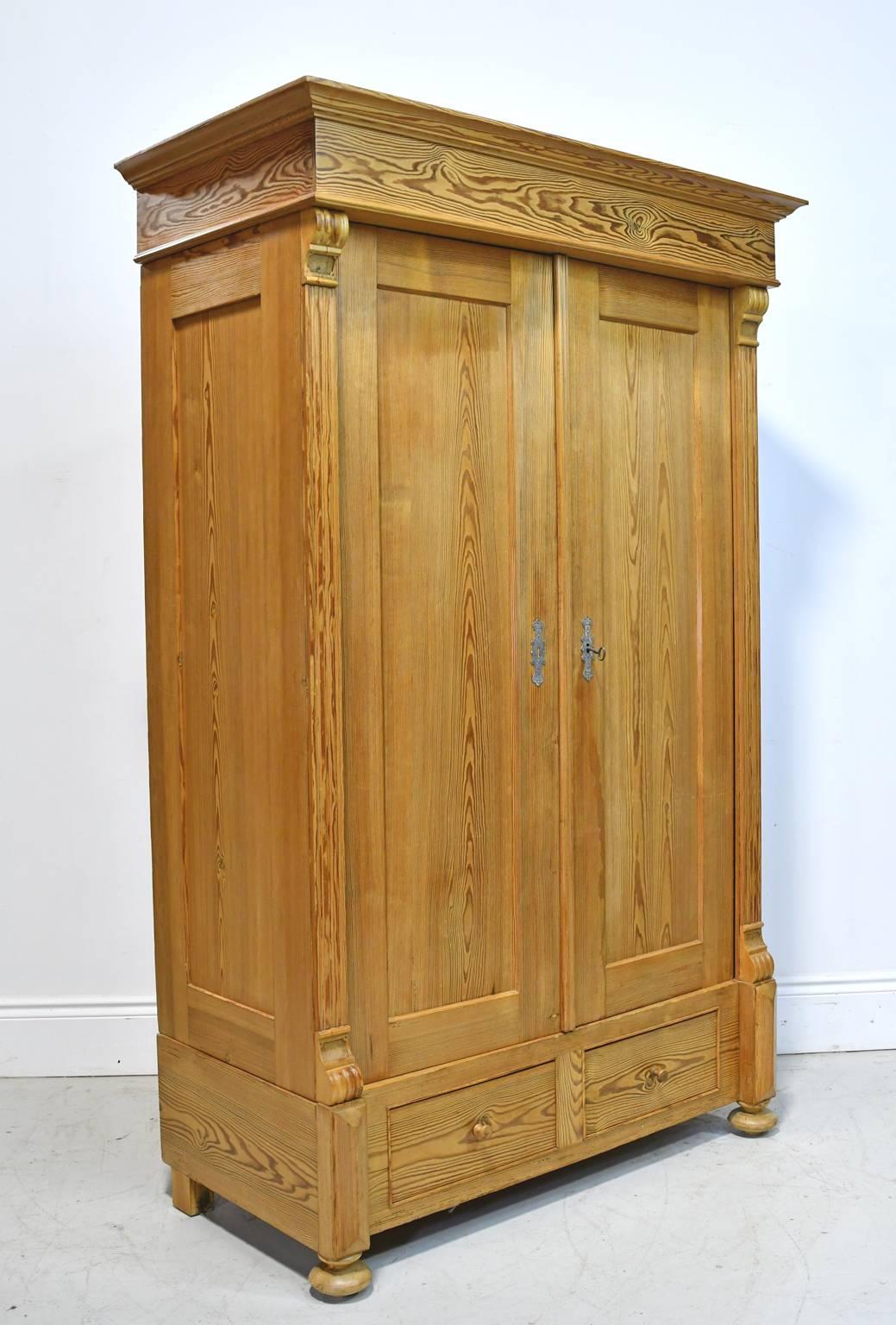 Carved 19th Century European Two-Door Pine Armoire with Drawers and Retractable Doors
