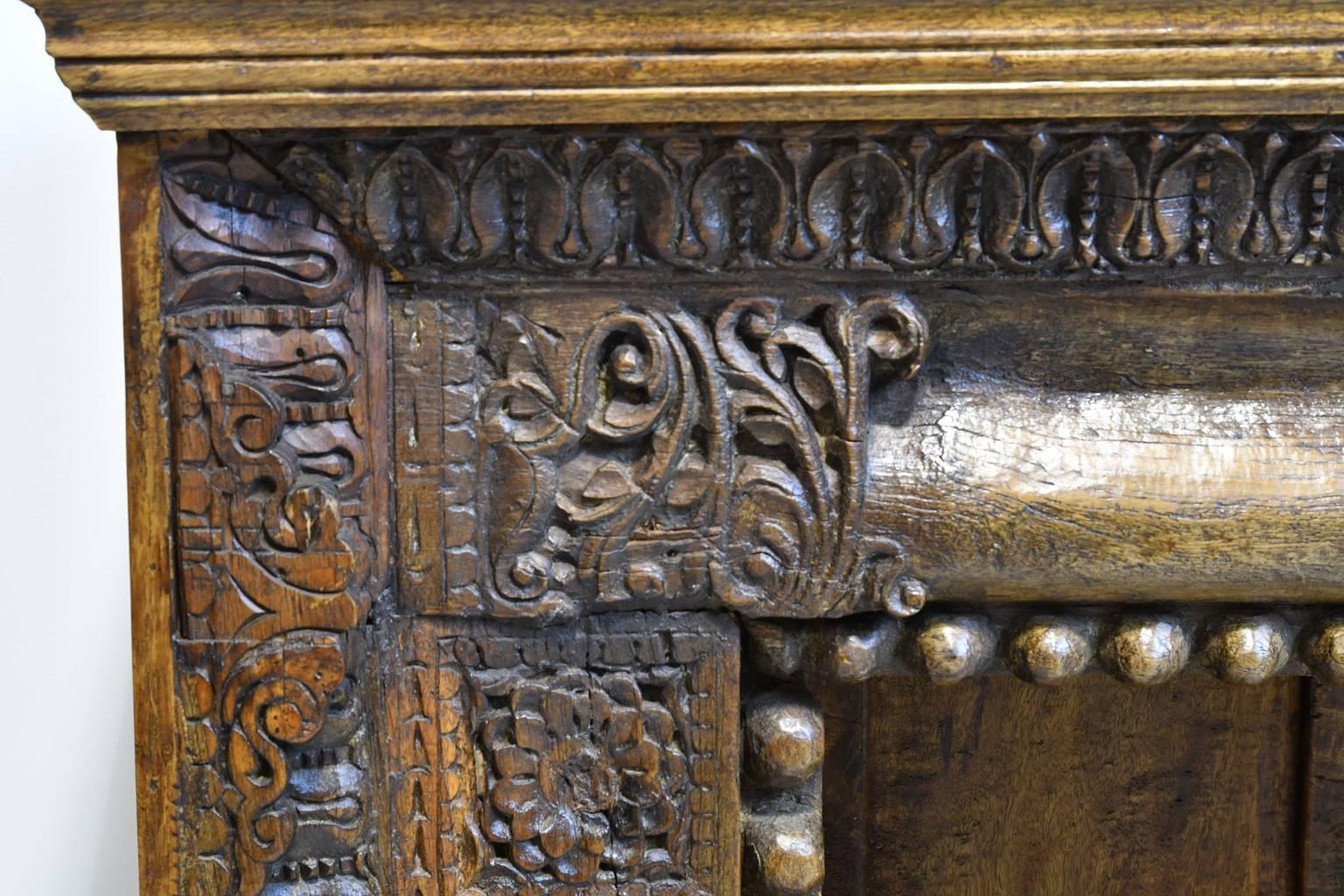 Anglo-Indian 20th Century Long Open Asian Bookcase in Teak with Carved Foliage and Flowers