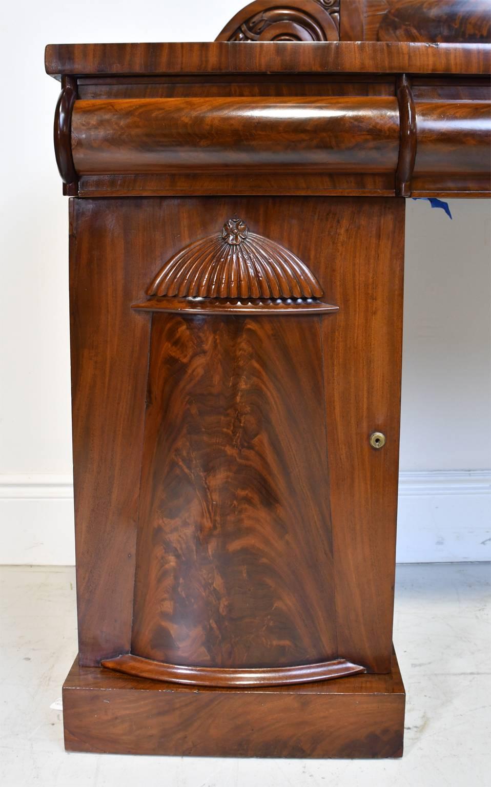 Hand-Carved English Regency Pedestal Sideboard in Mahogany with Carved Backboard, circa 1830 For Sale