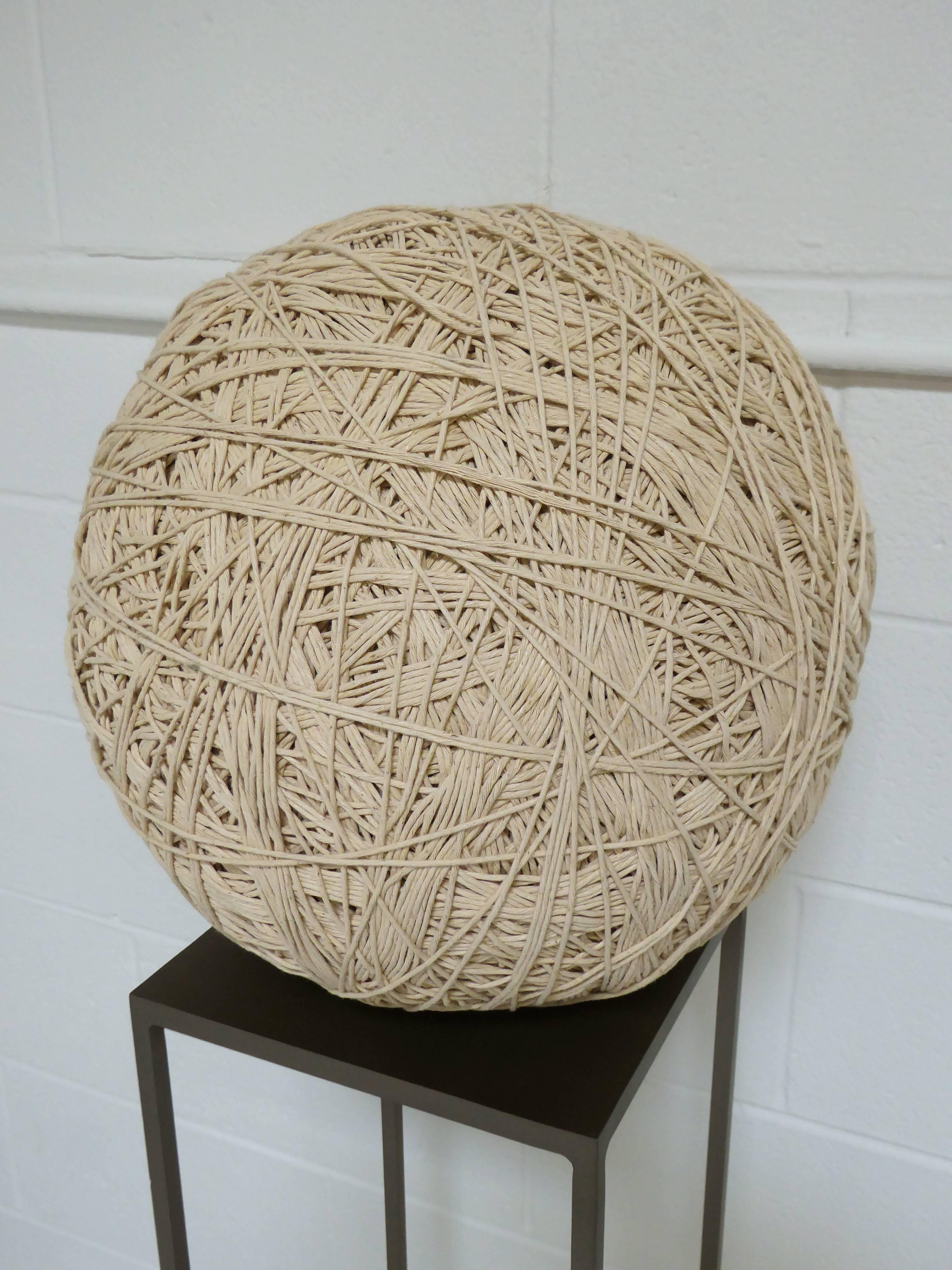 Monumental Primitive cotton twine ball sculpture on steel framed pedestal. Twine ball salvage from a Drygood Store in 1940s. Originally Used for tying parcels.

Ball of twine 15
