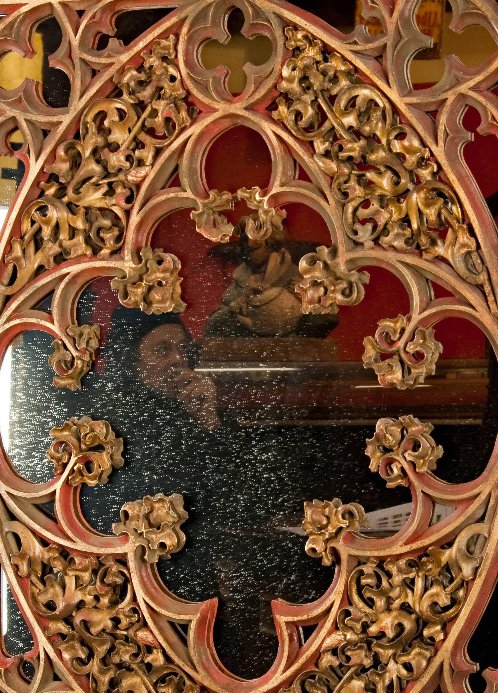 Neo-Gothic mirror, open-worked carved and painted wood. Executed, circa 1890. Framing and backplane replaced.