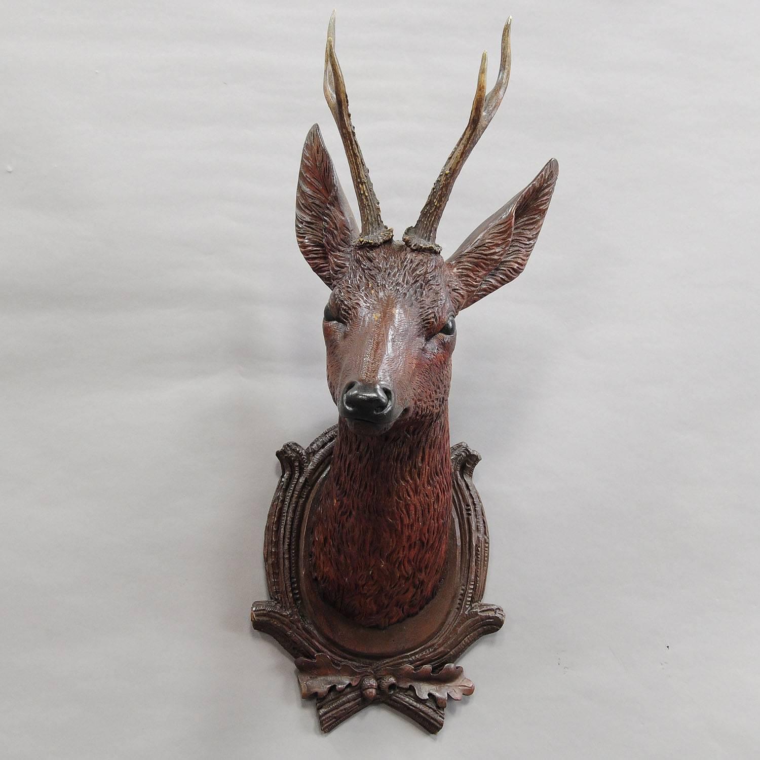 carved wooden deer head