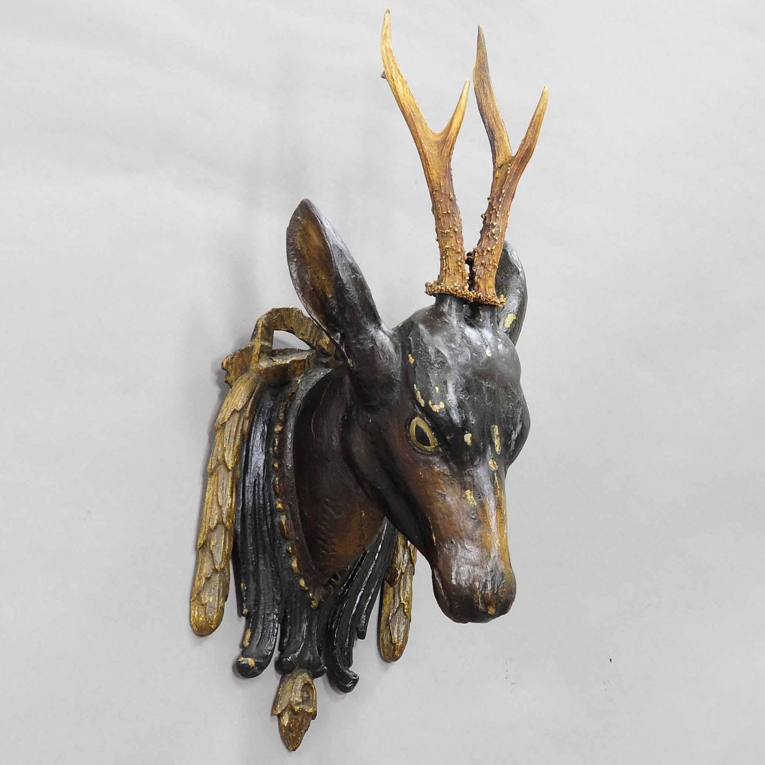 A hand-carved and painted wooden roe deer head with a large deer trophy and great wooden carved plaque executed, circa 1850.
