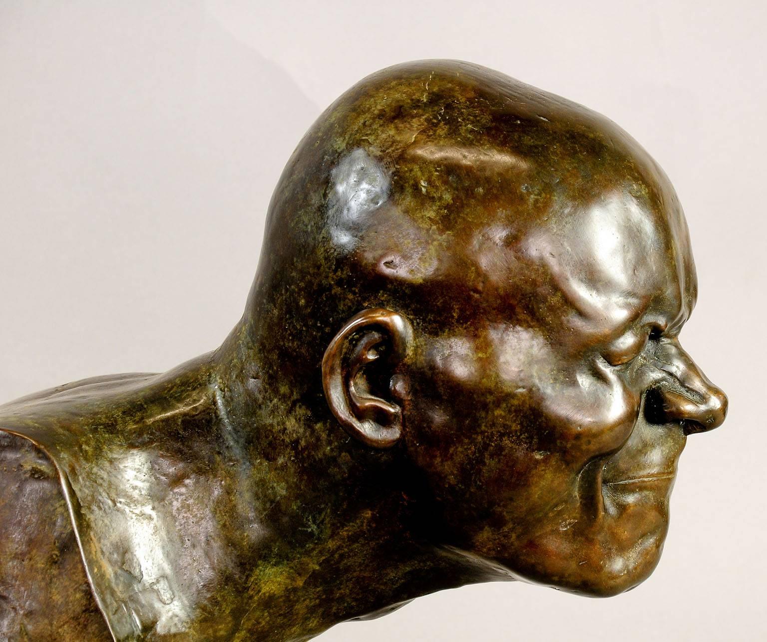 A large bronze statue on a marble base after Franz Xaver Messerschmidt depicting a smelling man. Recast, Germany, circa 1900.