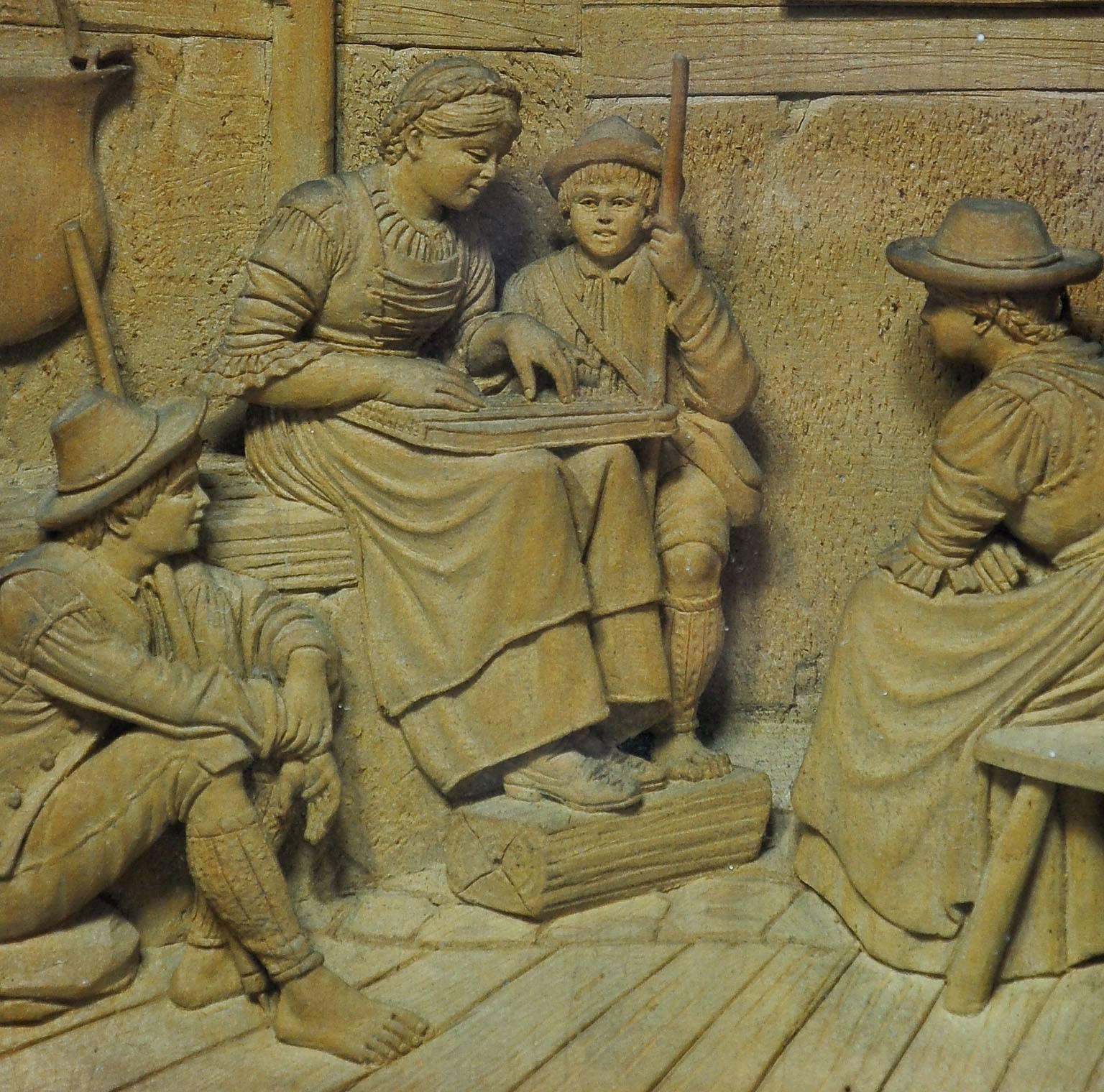 a fine three-dimensional woodcarving of a folksy scenery. the model for this carving was painted by franz defregger (1835-1921) and is titled 