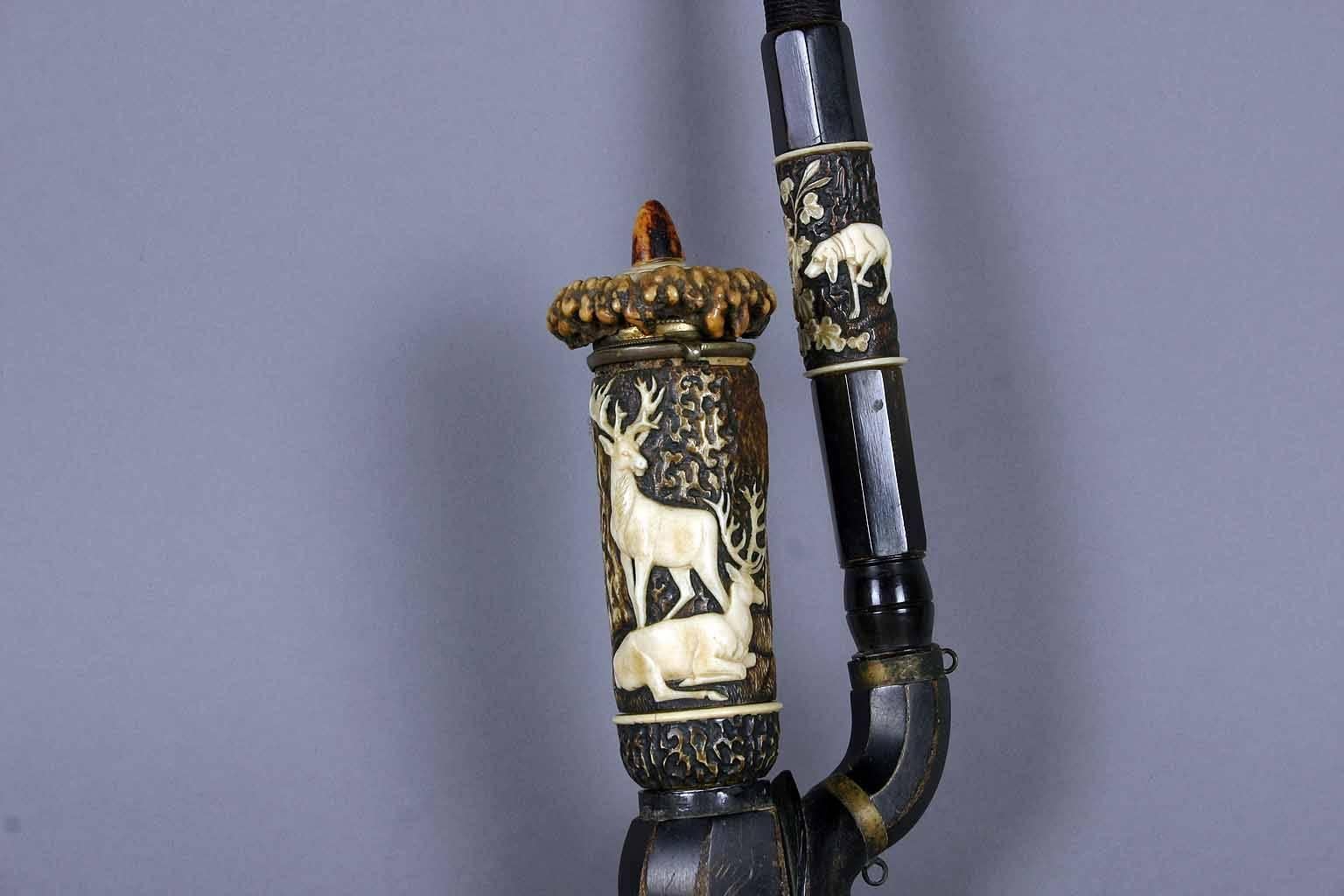 A rare pipe made of horn, with fine carved hunting scenes depicting a stag with doe and a staghound. The art work is attributed to Lebrecht Wilhelm Schulz, Meiningen, Thu¨ringen, Germany approximate 1840.

Lebrecht Wilhelm Schulz (1774 - 1863) was
